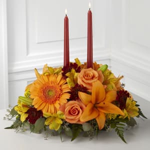 b4-4112 Bright Autumn Centerpiece b4-4112 Bright Autumn Centerpiece - Candles & flowers in fall colors make this centerpiece the perfect table decoration. The deluxe & premium include more flowers. Due to the current global floral shortage situation, ***FLOWER SUBSTITUTIONS/DESIGNER’S CHOICE*** is required due to limited product offerings. The flowers may be substituted, but the beauty, and price value will be maintained. Thank you for your understanding!