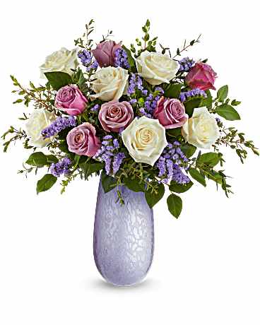 Teleflora's Marvelous Moments Bouquet - Make every moment magical with the Marvelous Moments Bouquet, a breathtaking all-rose arrangement in the hand-blown iridescent Vivi vase. Radiating romance and elegance, this timeless keepsake is the perfect way to celebrate love in style. The Marvelous Moments Bouquet features crÃ¨me roses, lavender roses, lavender sinuata statice, parvifolia eucalyptus, and salal. Arranged in the hand-blown iridescent Vivi vase, this elegant all-rose bouquet is a timeless expression of love and romance.
