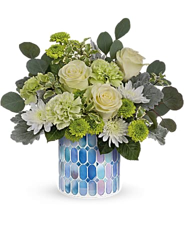 Teleflora's Serene Bliss Bouquet - Make any moment blissful with this serene rose bouquet that rises like fluffy white clouds above a beautiful blue mosaic glass vase. Green roses, green carnations, green button spray chrysanthemums and white cushion spray chrysanthemums are arranged with dusty miller, silver dollar eucalyptus and pitta negra. Delivered in a Blue Beauty Mosaic vase.