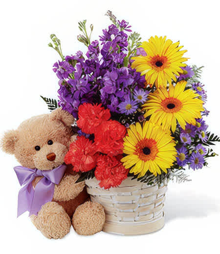 A Little Nuzzle - Let that unconditional friendship blossoms and grow as the days go by. Nuzzle up with that cozy fuzzy teddy bear and a cup of hot cocoa. That extra touch of brilliant blossoms in vibrant shades of purple, orange, and yellow are just the brunt of the highlight!   Actual bear may vary Add water daily to ensure your floral arrangement stays fresh and display the flowers in a cool location away from direct sunlight.