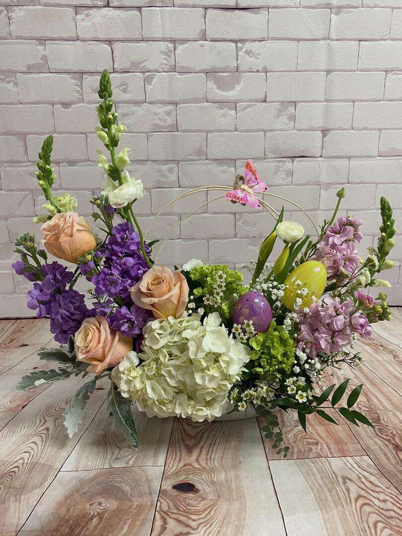 Pastel color flowers with Easter Eggs and butterfly Pastel color flowers with Easter Eggs and butterfly - This arrangement has pastel color flowers with Easter Eggs and butterfly, including stocks, hydrangeas, roses snapdragons, ranunculus , baby's breath and greens.