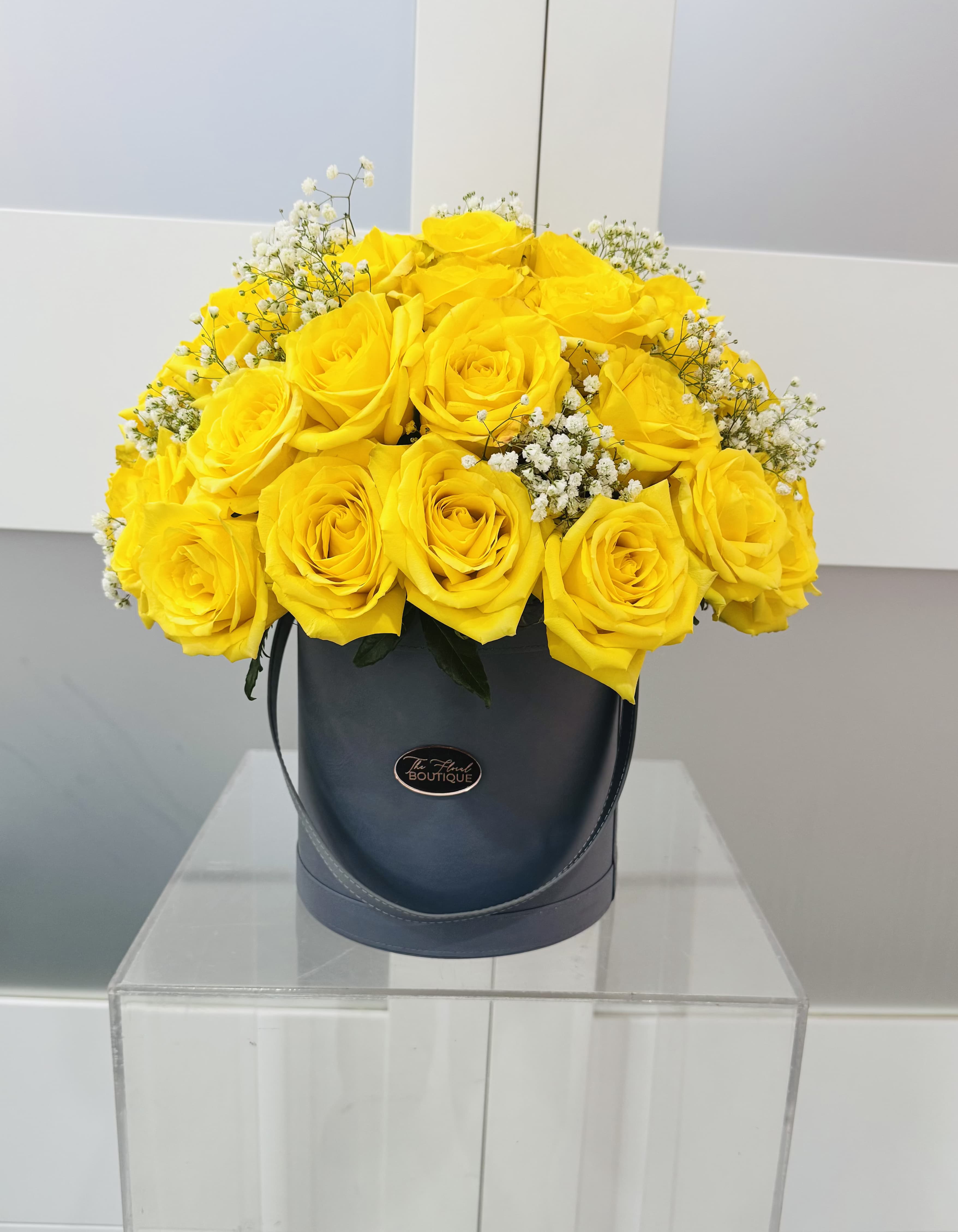 50 Yellow Rose Hat Box - For the yellow rose lover, we present 50 premium ecuadorian roses with fillers beautifully presented in our hat box.  Yellow symbolizes warm,  joy, friendship, and positivity.