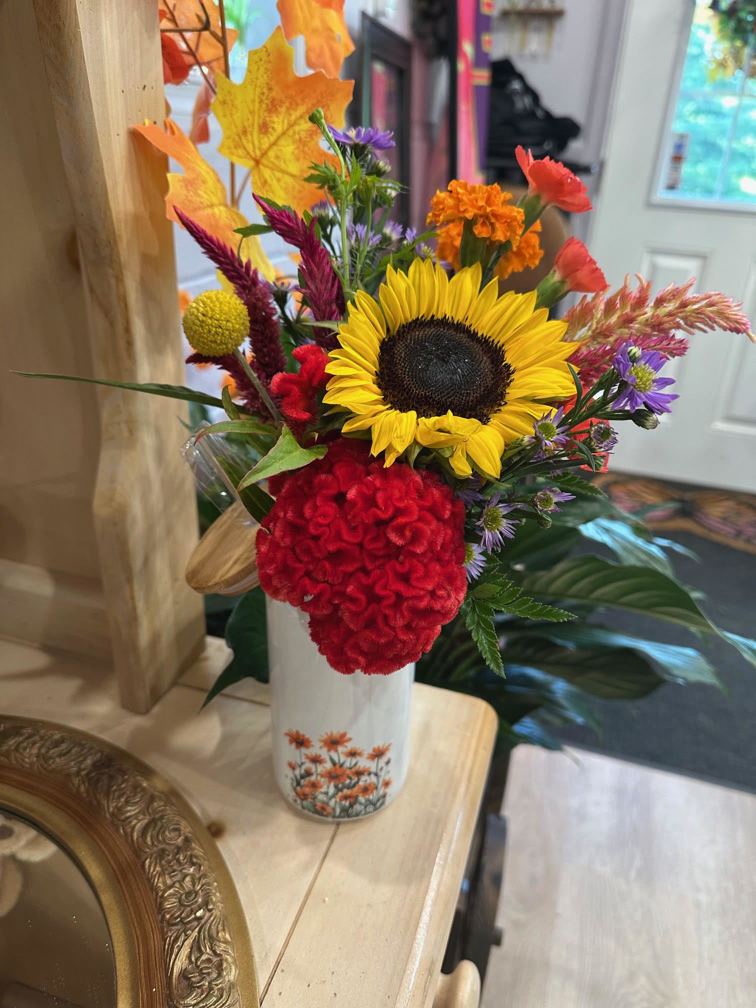 Welcome Back  - *Only available for a limited time*  Nothing like bringing in the new school year and the upcoming season with some beautiful seasonal flowers. All the flowers used in this arrangement were gathered from local growers in the area.   This arrangement comes with a reusable cup, lid, and straw.   Order now while supplies last!