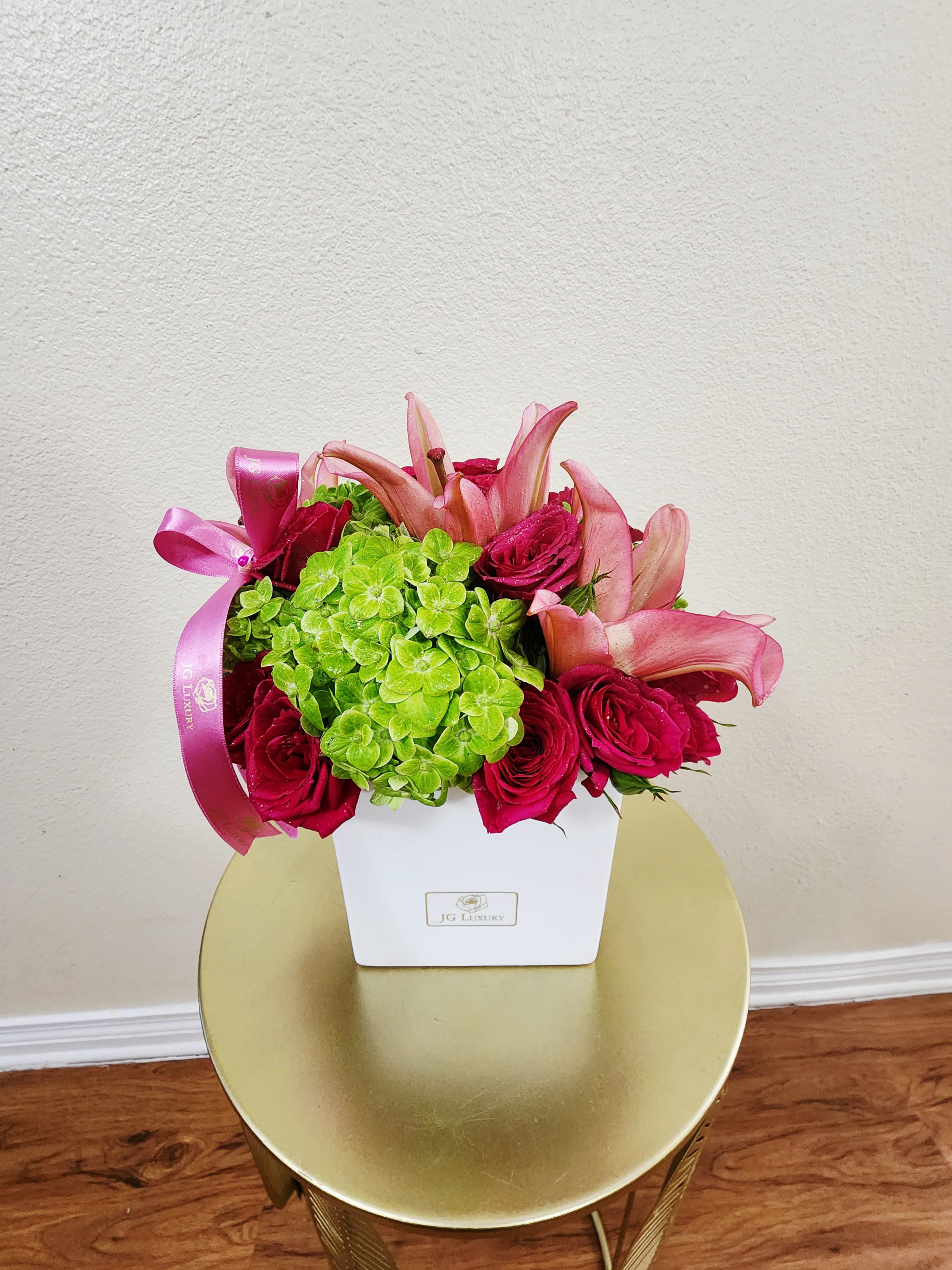 Bright &amp; Lively by BloomNation™ - This colorful, spring bouquet contains lilies, spray roses, and hydrangea. It is the perfect gift for to celebrate a birthday or new beginnings. APPROXIMATE DIMENSIONS: 9.5&quot; L X 9.5&quot; W X 9.5&quot; H
