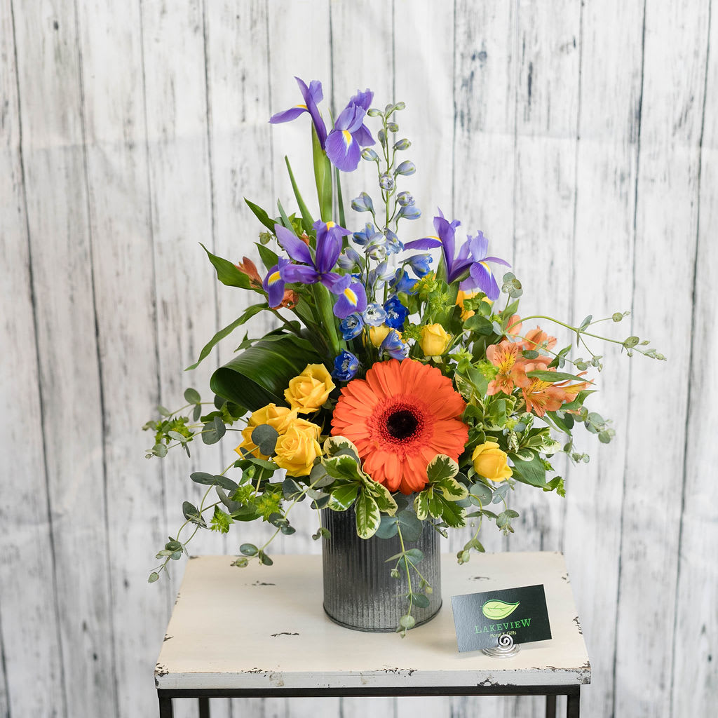 Native - Earthy and organic in style, a galvanized tin overflows with garden blooms in purples and orange with bupleurum.  Approximate Dimensions: 22&quot;H x 14&quot;W