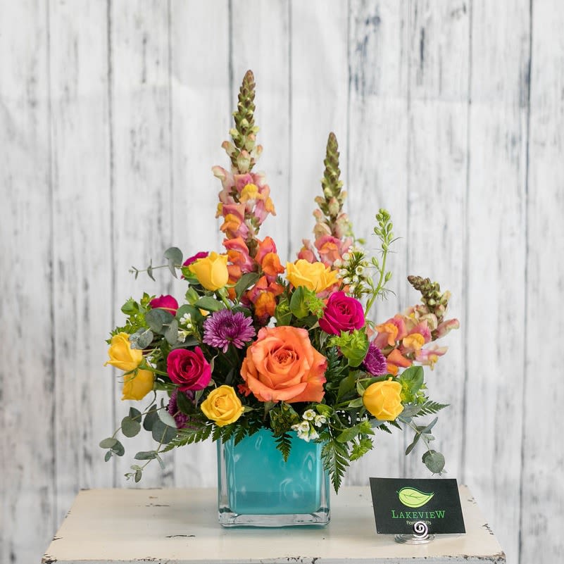Splash - Bright &amp; fun!  Bring sunshine with this arrangement of snapdragons, spray roses and button mums in yellows, oranges, pinks and purples!  Approximate Dimensions: 16&quot;H x 14&quot;W