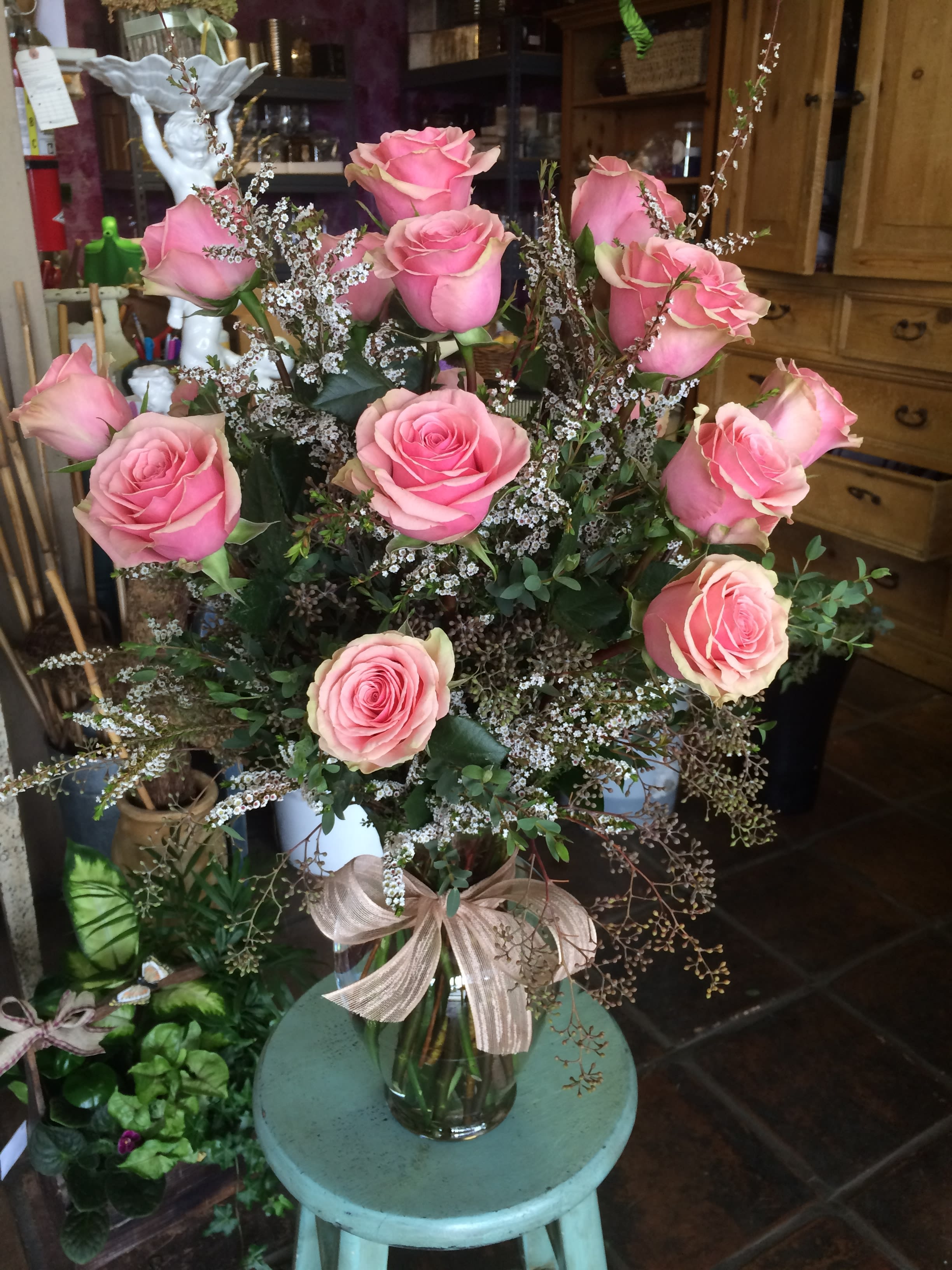 One Dozen Long Stemmed Roses One Dozen Long Stemmed Roses - One dozen long stemmed roses in a vase. Choose your color of roses - Most colors available. *Greens and fillers may vary.