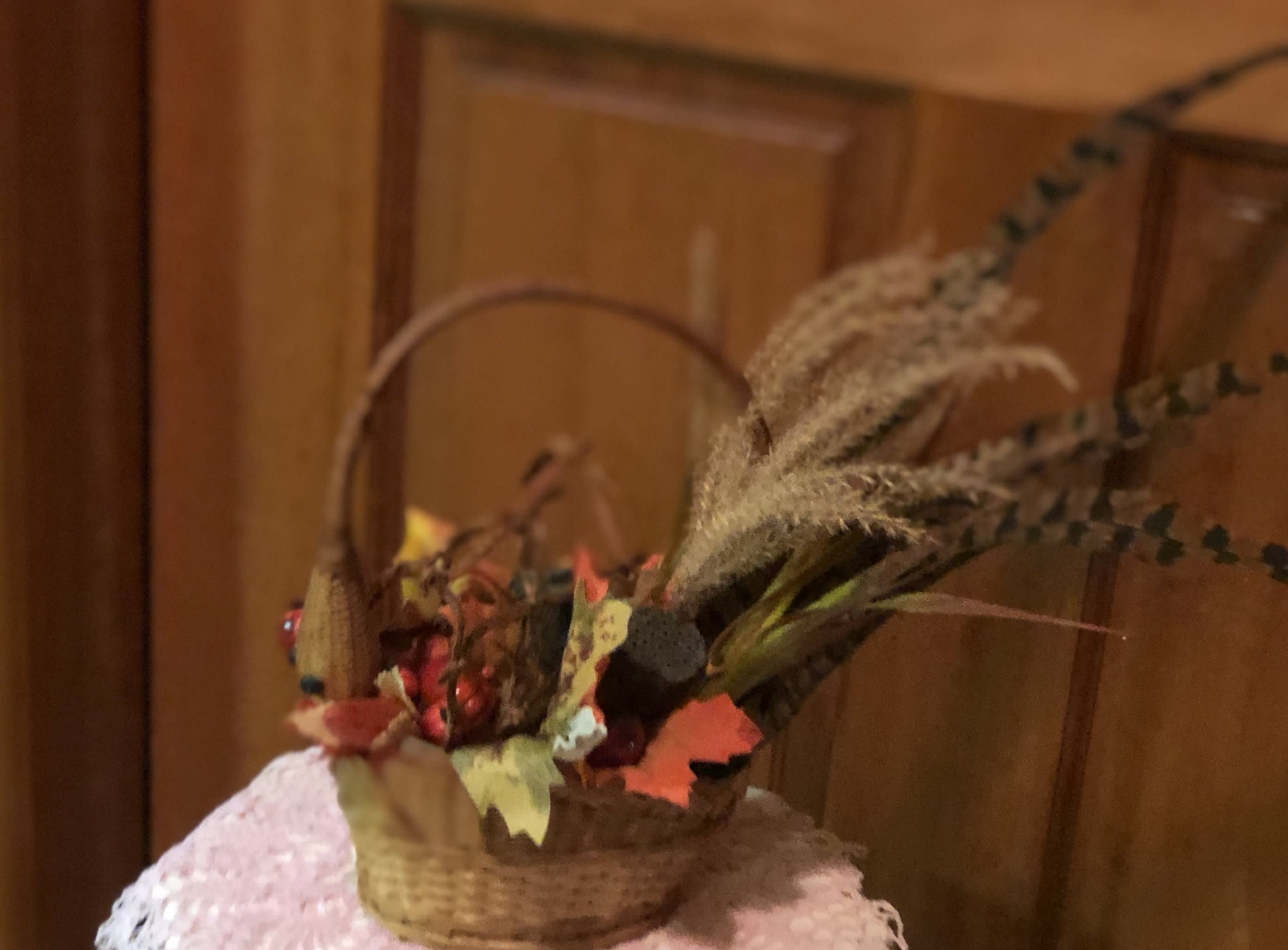 Pheasant (dried accents) - One of a kind creation of a pheasant hiding his head in his wing. Created out of dried and silk botanicals. Keepsake. Use every year. Great for a tabletop centerpiece, corner end-table or bedside decoration. (only 1 available)