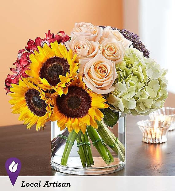 Autumn Gathering Autumn Gathering - EXCLUSIVE Our colorful bouquet celebrates autumn’s rich beauty. Harvest-toned blooms are loosely gathered with pops of peach for a touch of sweetness.