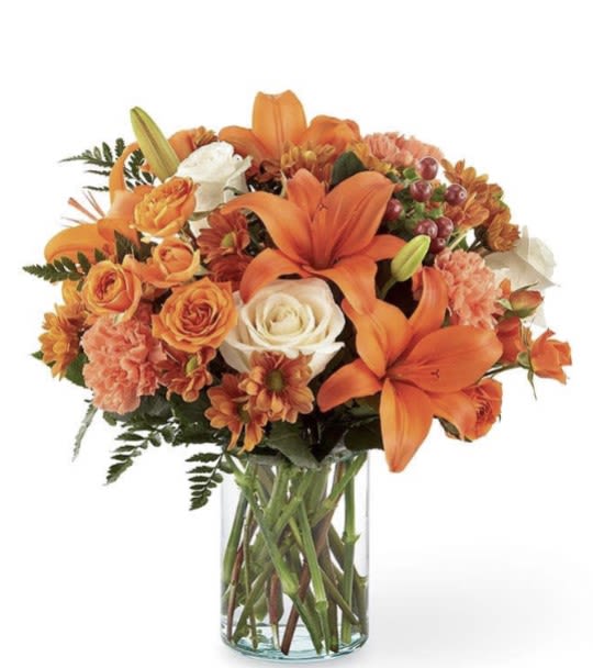 Fall Blossoms Fall Blossoms - Embrace the beauty of fall with our exquisite fall Blossoms arrangement! Handcrafted with vibrant hues of fall colors, our arrangements capture the essence of the season. Celebrate your loved one with a special warm fall arrangement to brighten their day.