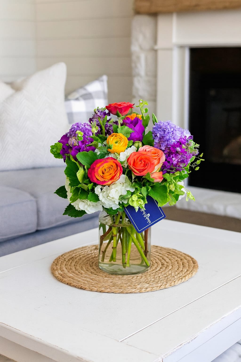 Cherish  - Are your family and friends always looking for unique and memorable gifts? Show them just how much you cherish them with Cherish! This stunning floral bouquet is the perfect way to do just that. With a gorgeous mix of orange roses, purple stock, white hydrangeas, and other orange and yellow seasonal flowers, arranged in a clear cylinder vase, this premium arrangement has a wow factor like no other. Not only is it a vivid representation of how much you adore your favorite people, but the beautiful colours will brighten up any room. Give the perfect gift with Cherish. Whether it's a special occasion or just because, show you really do cherish them!