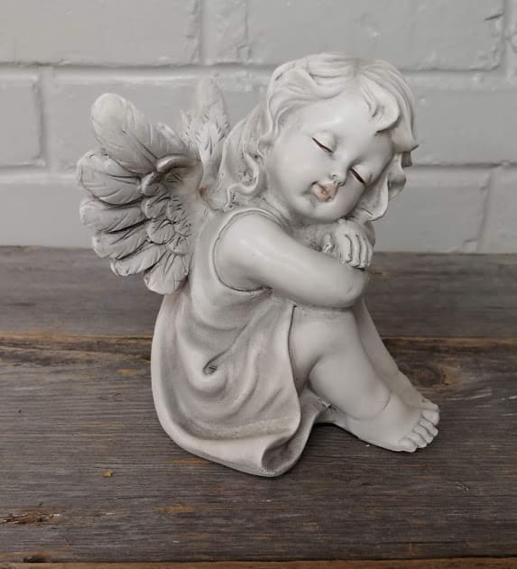 Resting Angel Resting Angel - Adorable Angel at rest. She is 6 1/2 inches tall. Cute by herself or placed in an arrangement.