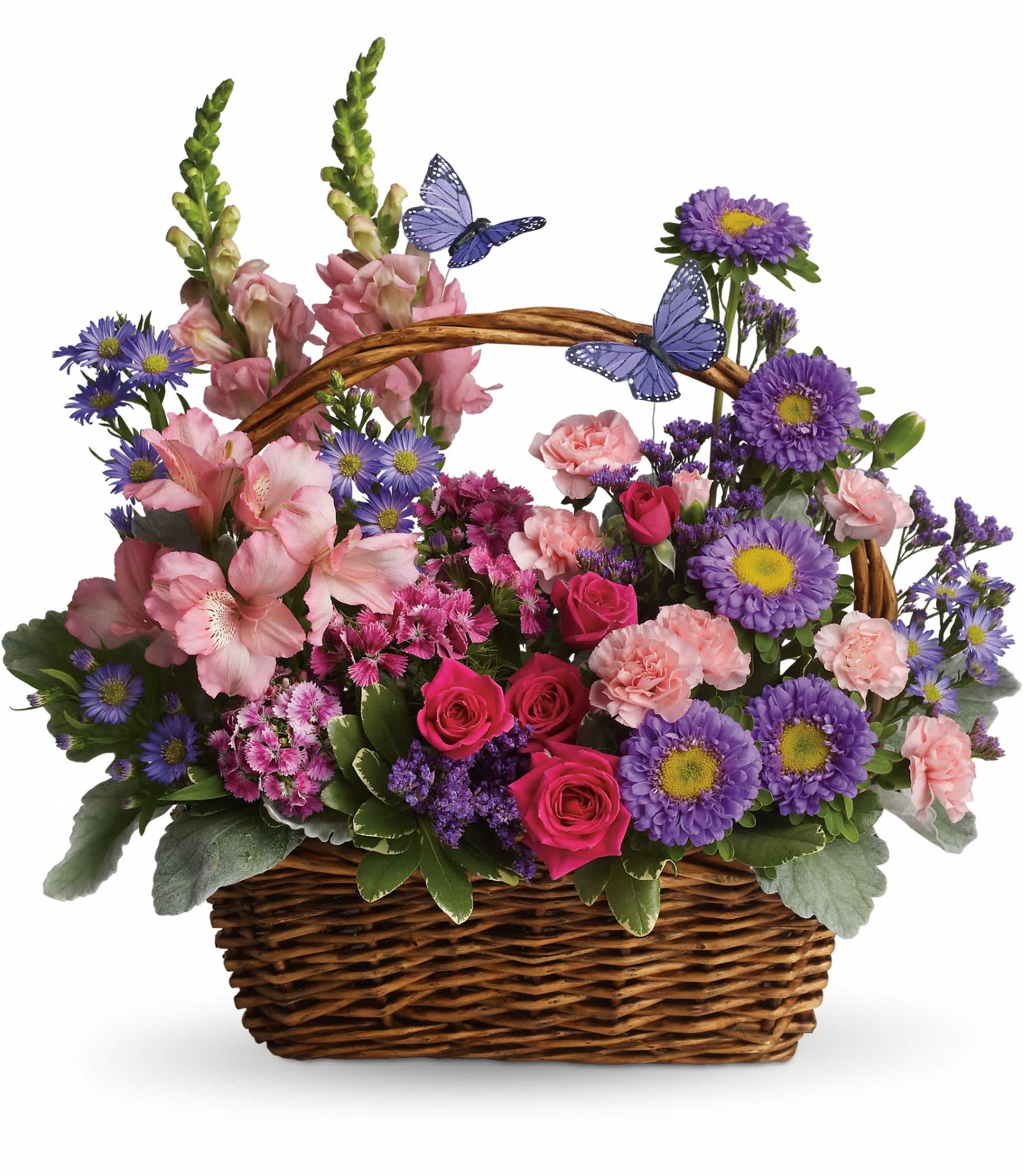 Country Basket Blooms by Teleflora Country Basket Blooms by Teleflora - Talk about a bountiful basket! This wicker basket is overflowing with beauty and blossoms. It's no wonder two pretty butterflies have made this basket their home.