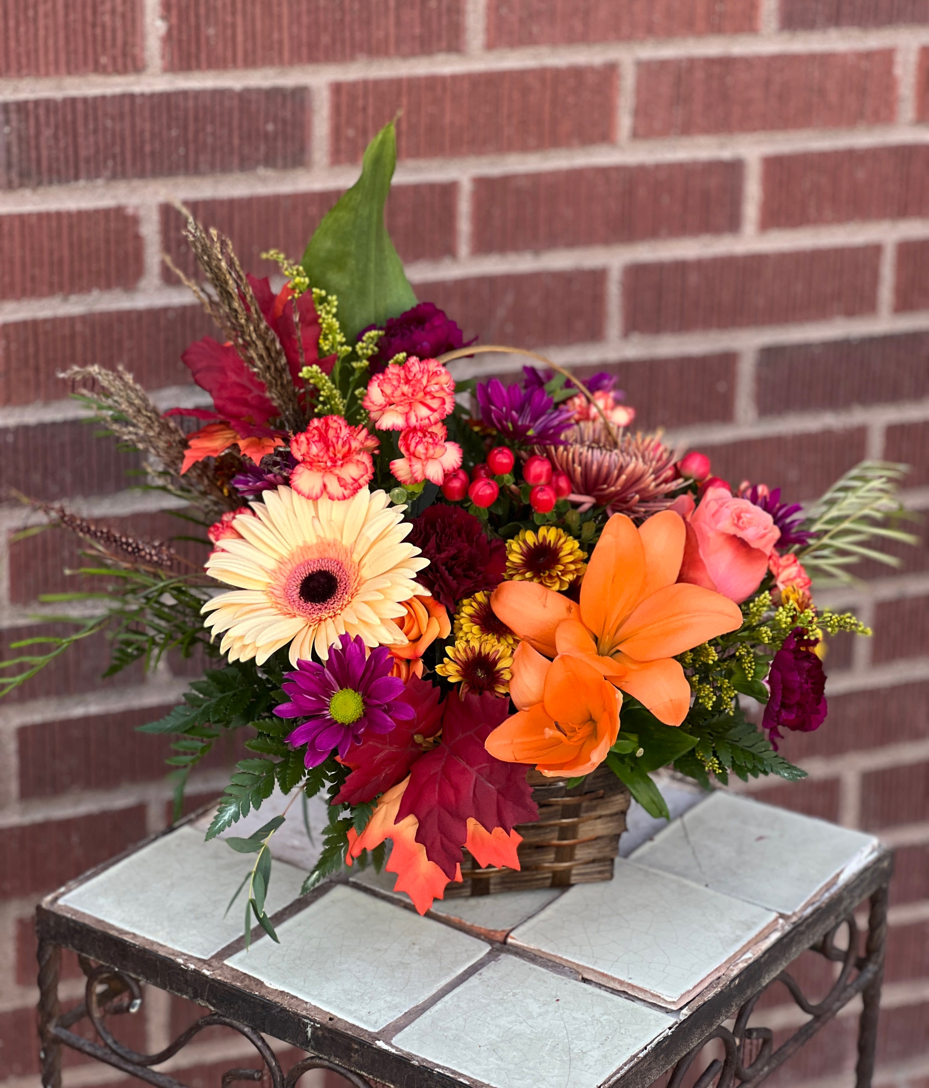Basket of Fall - Fall blooms, designed by one of our local gals! Featuring gerberas and lilies.