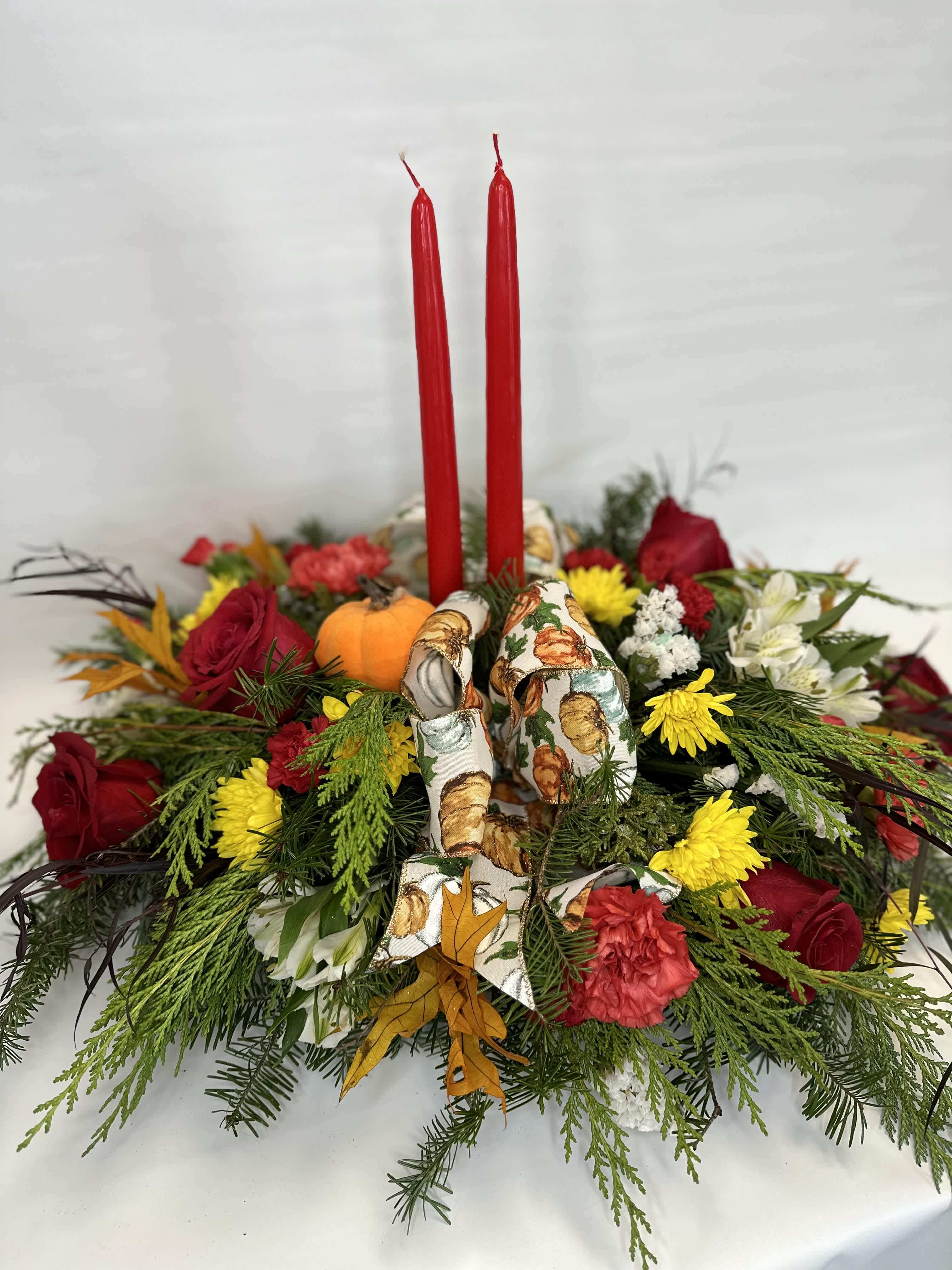 Give Thanks - Fall inspired table centerpiece with fresh flowers in seasonal colors. Candles finish off this stunning piece.
