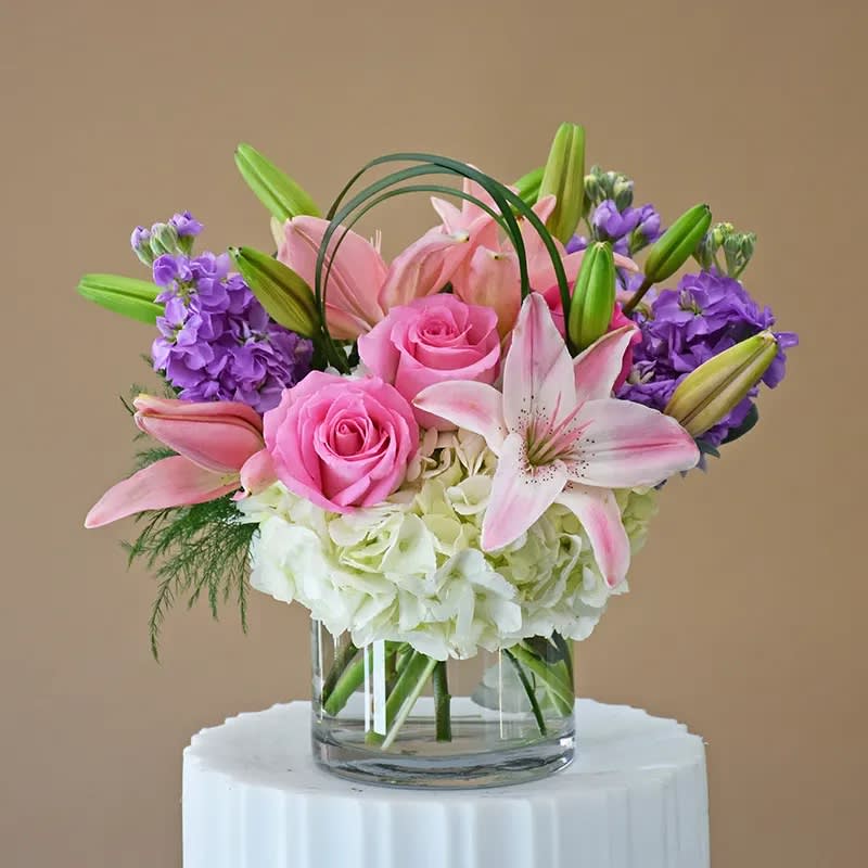 Pastel Love Pastel Love - Lavender stock, pink roses, hydrangeas and fragrant lilies in a clear cylinder
