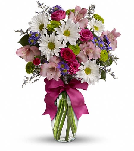 Pretty Please Pretty Please - Looking for the prettiest bouquet in town? We've got the perfect all-around choice! Pretty Please is a flower bouquet with all the right stuff - a lovely mix of fresh flowers in breezy shades of pink white lavender and more at a wonderfully reasonable price all tied up with a big pink bow. A great way to make someone smile. A mix of fresh flowers such as spray roses daisy and button spray chrysanthemums Monte Cassino asters and limonium in shades of white pink green purple and lavender. Delivered in a vase adorned with a matching ribbon.Approximately 11 1/2" W x 15" H Orientation: One-Sided As Shown : TEV12-4ADeluxe : TEV12-4BPremium : TEV12-4C