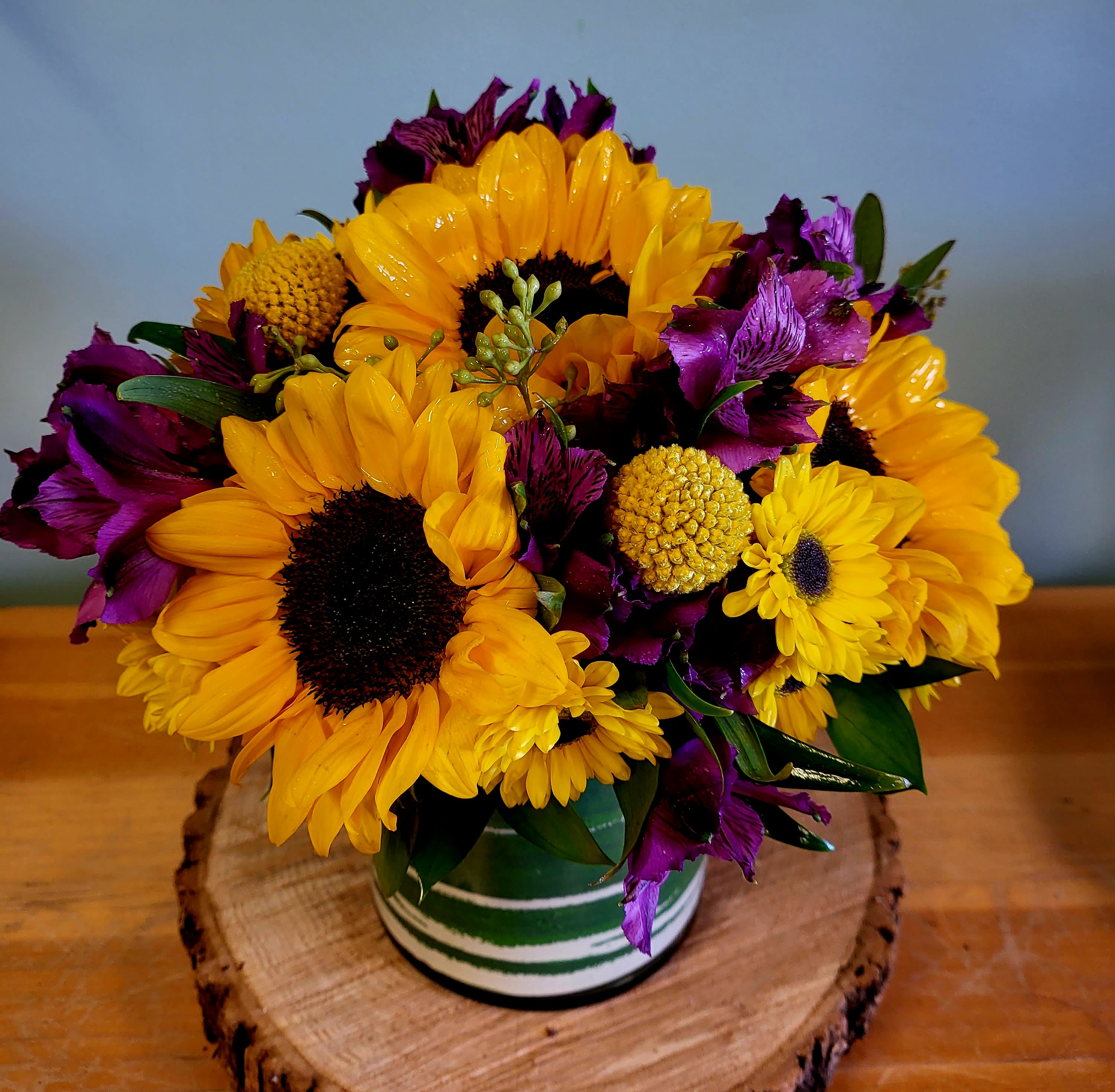 Always Sunny in Colorado  - Fill you home with more sunshine. We blessed with 245/ or more days of sun, so bring more sunshine into you home with this beautiful arrangement.  Filled with Sunflowers and different color of Alstroemeria, and the freshest additional flowers in a variety of colors.
