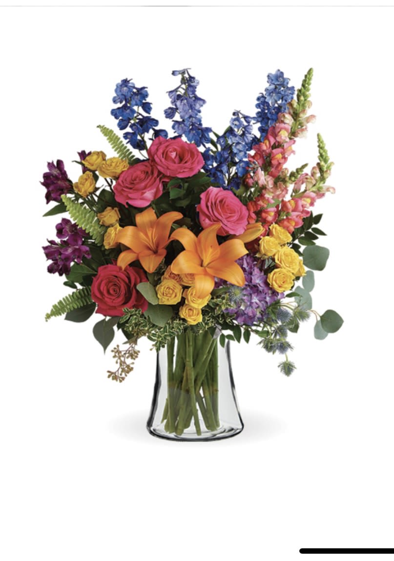 The Rainbow The Rainbow - clear vase with card massage 1 stem purple hydrangea, 5 pink roses *, 3 stem yellow spray roses *, 1 stem orange asiatic lilies *, 3 stems purple alstro, 4 stems blue delphinium *, 3 pink snapdragons *, 1 stem blue eryngium, 1 stem huckleberry, 1 stem oregonia, 2 stems israeli ruscus, 3 stems
