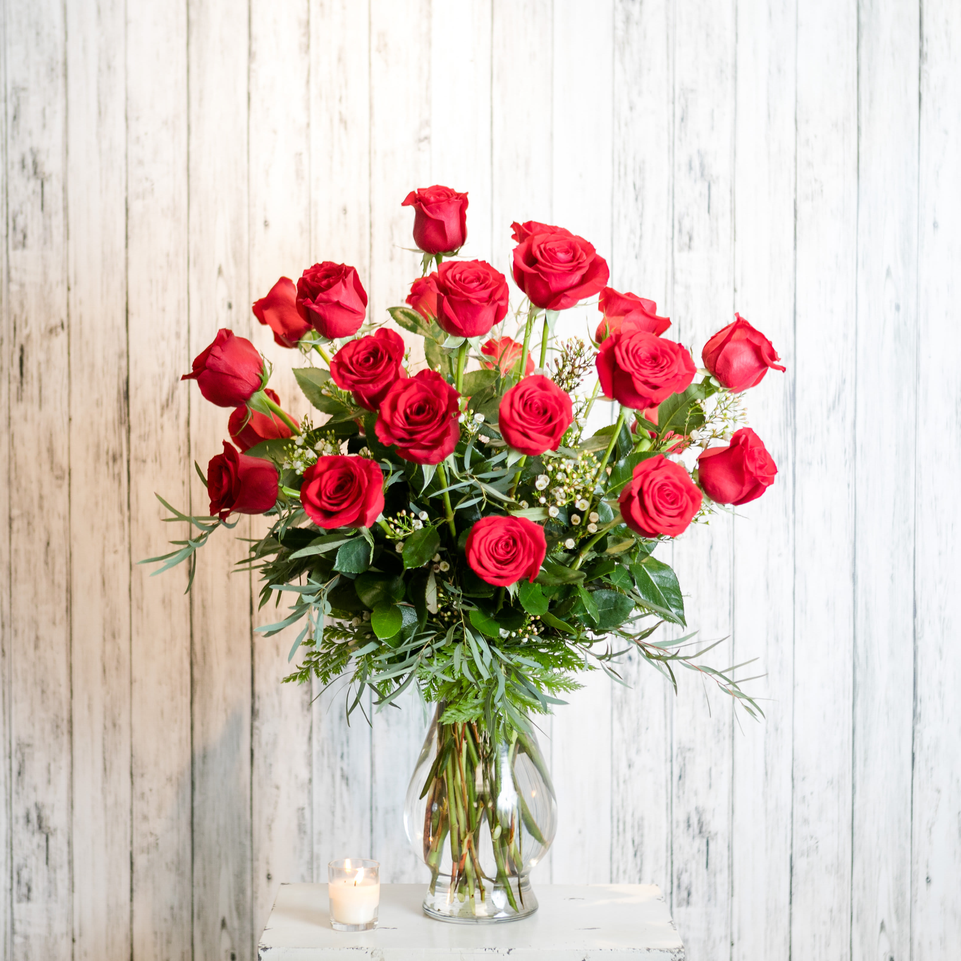 Heartthrob - Make an impression! Twenty-four long stemmed red roses vased with textural foliage and petite filler blooms.   Approximate Dimensions: 28&quot; H x 20&quot; W
