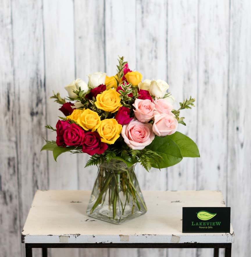 Fifty - A simple and elegant arrangement made up of spray roses, in a variety of colors.  Approximate Dimensions: 12&quot; T X 10&quot; W 
