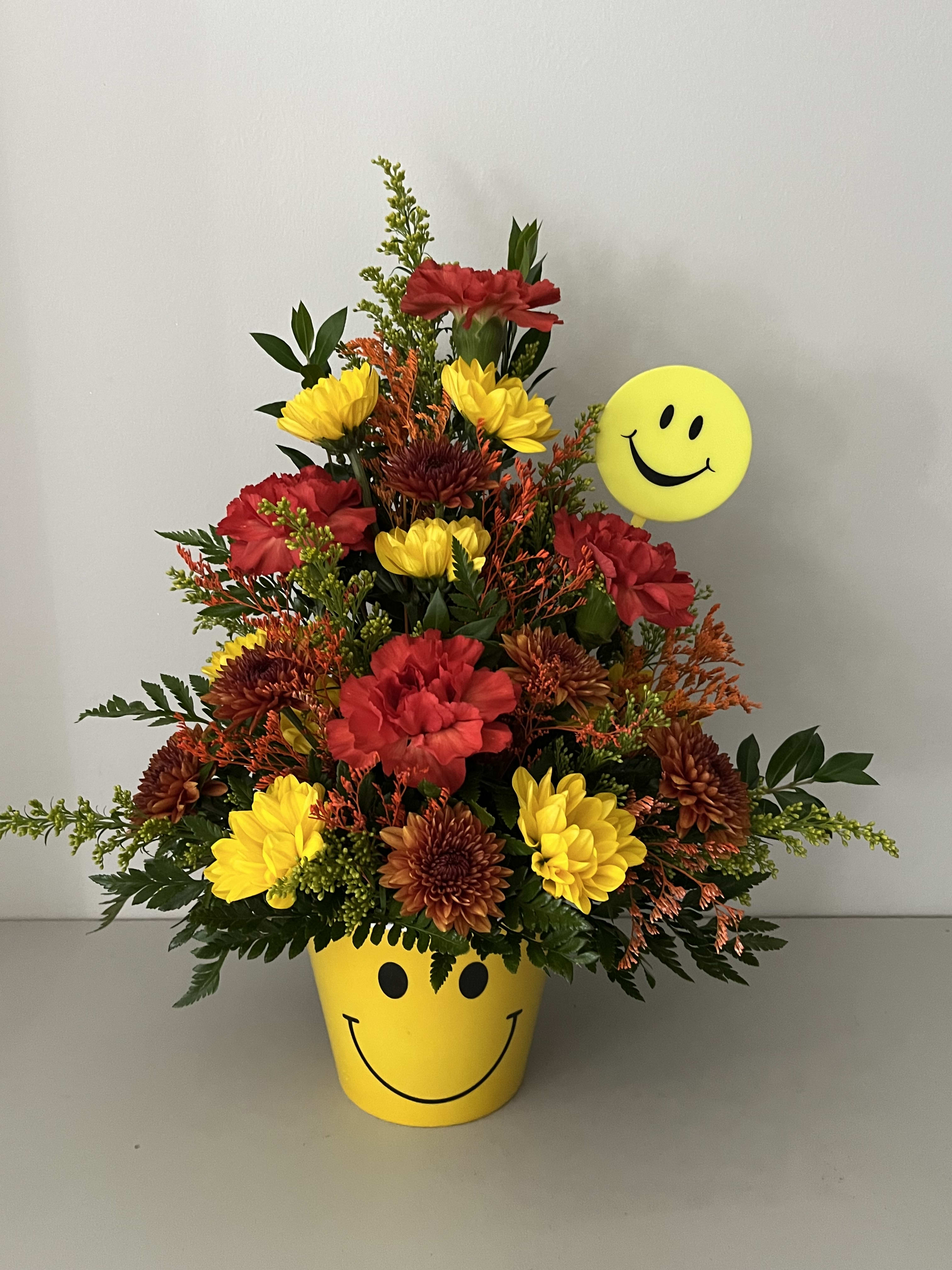 Autumn Smiles Autumn Smiles - Fall Mix Smiley Face Container with Carnations and Daisy
