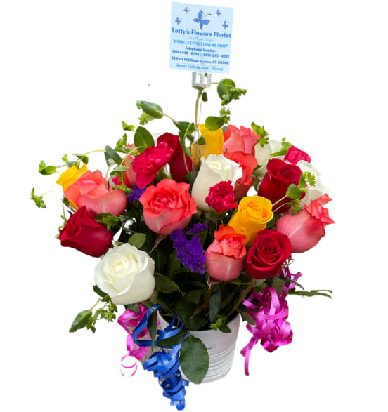 Happy Arrangement Assorted Roses Happy Arrangement Assorted Roses - Beautiful arrangement with 12 Assorted Roses with carnations, bupleurum and fresh greens adorned with festive colorful bows.