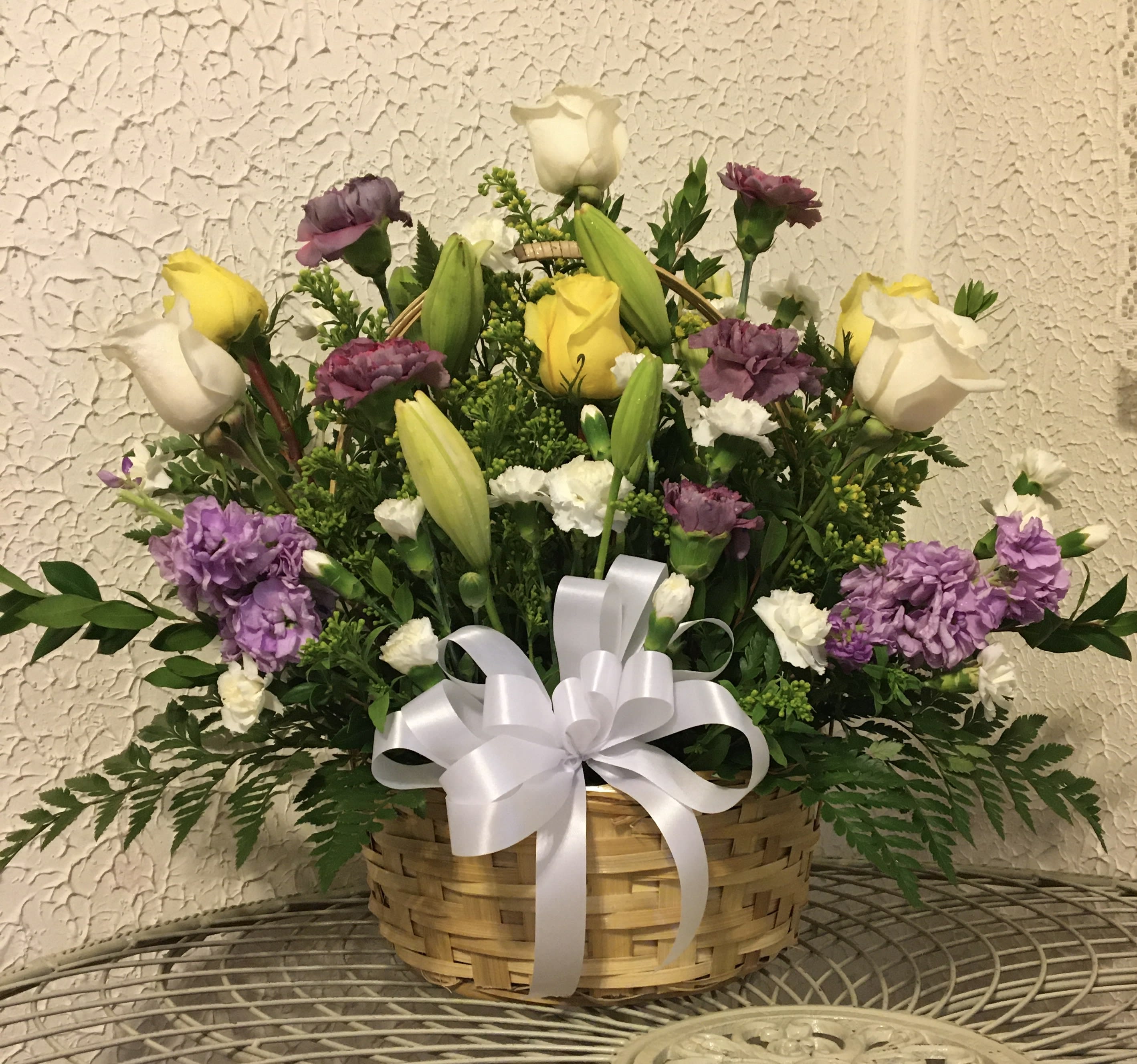 Beautiful Blessings Basket - arrangement includes, Lilies, roses, carnations, mums, filler and assorted greenery in a wicker basket