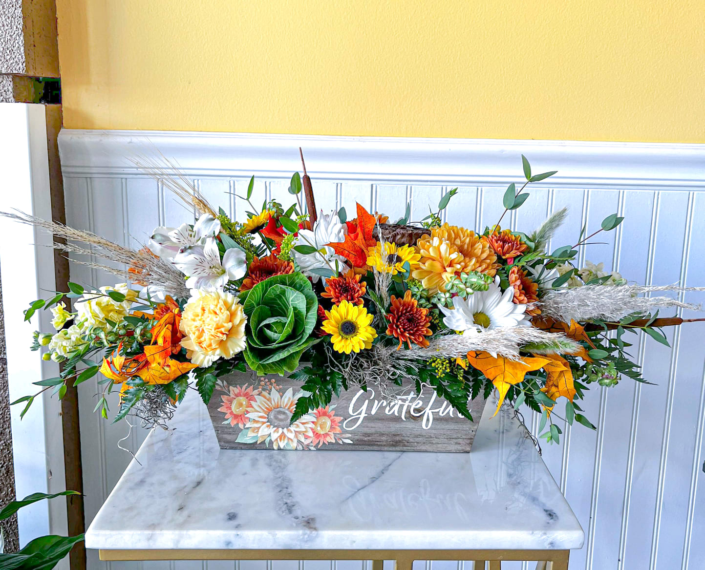 Grateful Bouquet - This breathtaking array of fall flowers arranged in a wooden planter is sure to spruce up any space.  It's great for table centerpiece or accent table! 