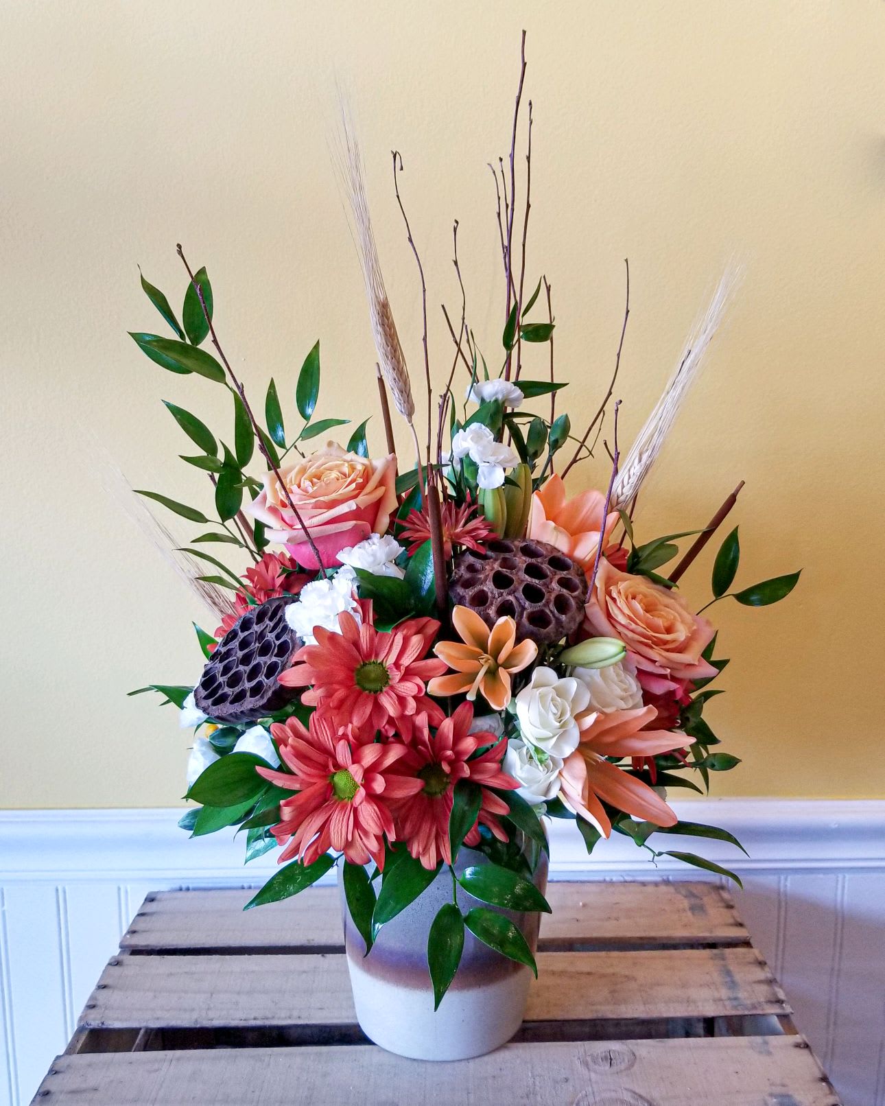 Autumn Romance - Full of fall romance, this radiant autumnal arrangement arrives in a stunning stoneware vase with reactive glaze and distressed details, making it a favorite year-round accent piece or kitchen crock!