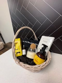 CALM AND COLLECTED BASKET CALM AND COLLECTED BASKET - Our Calm and Collected Basket is designed for anyone who does everything and deserves a moment to breath. Thoughtfully curated to sooth senses, restore balance, and bring a little calm to even the busiest days, this wellness gift is a reminder that she deserves peace too. It Includes Cork Top Candle Orange Blossom Honey Soap Orange Blossom Honey Gift Collection This is How you Heal Book (101 Essays That Will Change The Way You Think) Hormonal Balance Magnesium Mist In My Healing Era -Black T-Shirt Just let us know what size T-shirt (S-XXL)