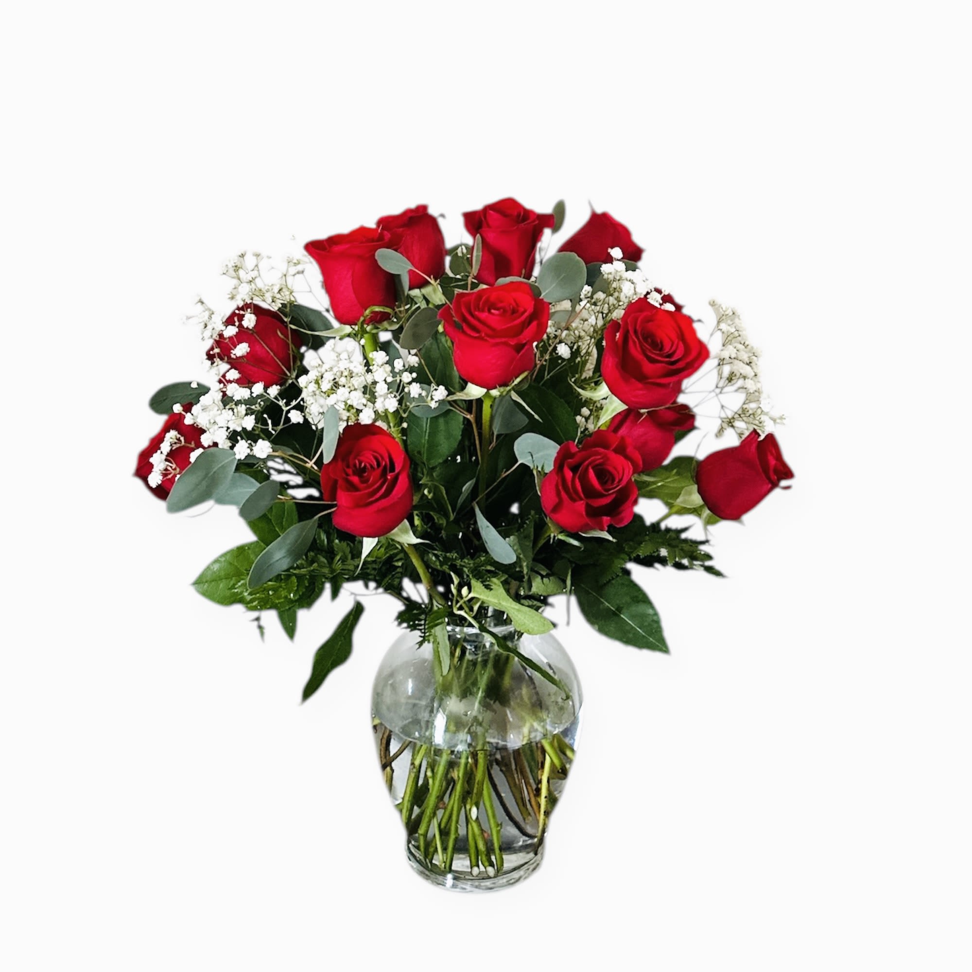 Rose Elegance Red Rose Elegance Red - Rose Elegance. A sophisticated arrangement that embodies the classic beauty of red roses. Surrounded by delicate baby’s breath and lush greenery, each rose stands out, radiating elegance and charm.