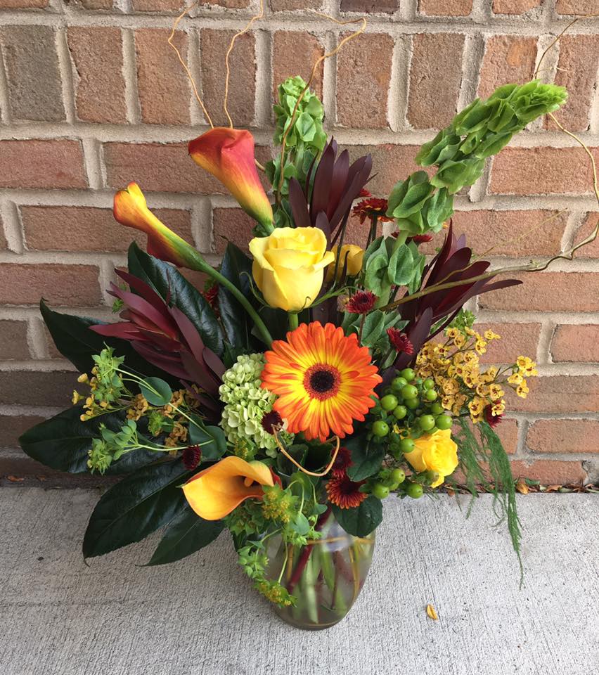 Autumn Elegance Autumn Elegance - A simply gorgeous display of some of the unique blooms and foliage available in autumn designed in a clear glass vase. Flower varieties will vary based on our weekly inventory.