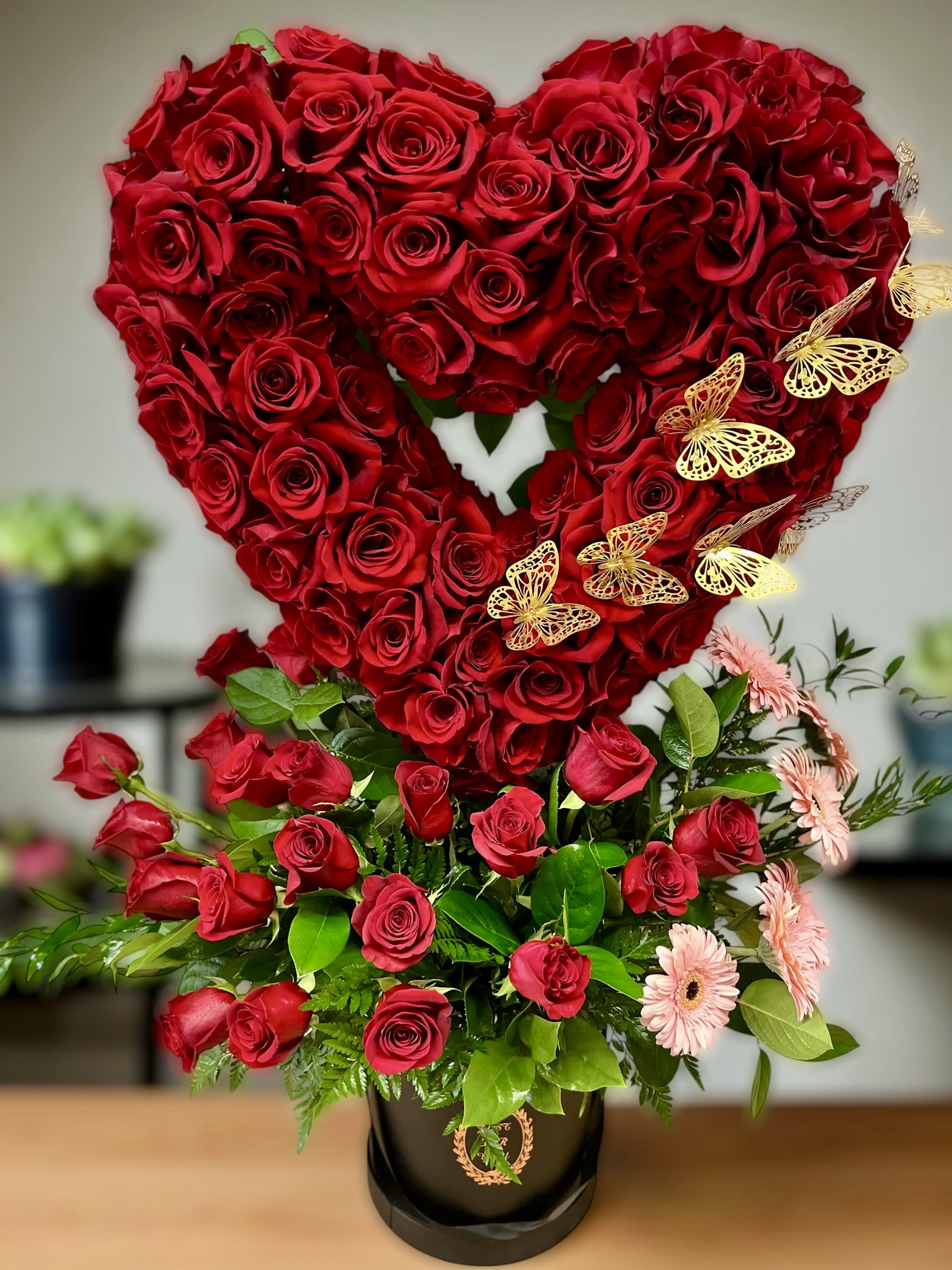 The Best Ever The Best Ever - A masterpiece of love and elegance This stunning arrangement features a heart full of fresh red roses, symbolizing deep love and passion. Accented with delicate golden butterflies and soft pink blooms, it’s the perfect design to express affection, romance, and admiration.