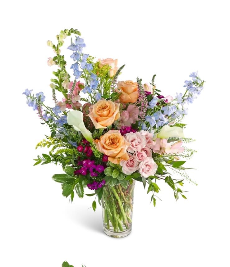 Botanical Beauty Botanical Beauty - A soft color palette is used for this large mixed bouquet using the freshest selection available to create this tall, sweeping floral design. Delivered in a tall clear glass vase. The perfect choice for love and romance, birthdays or any special occasion. Measures approx. 20" high and 16" wide