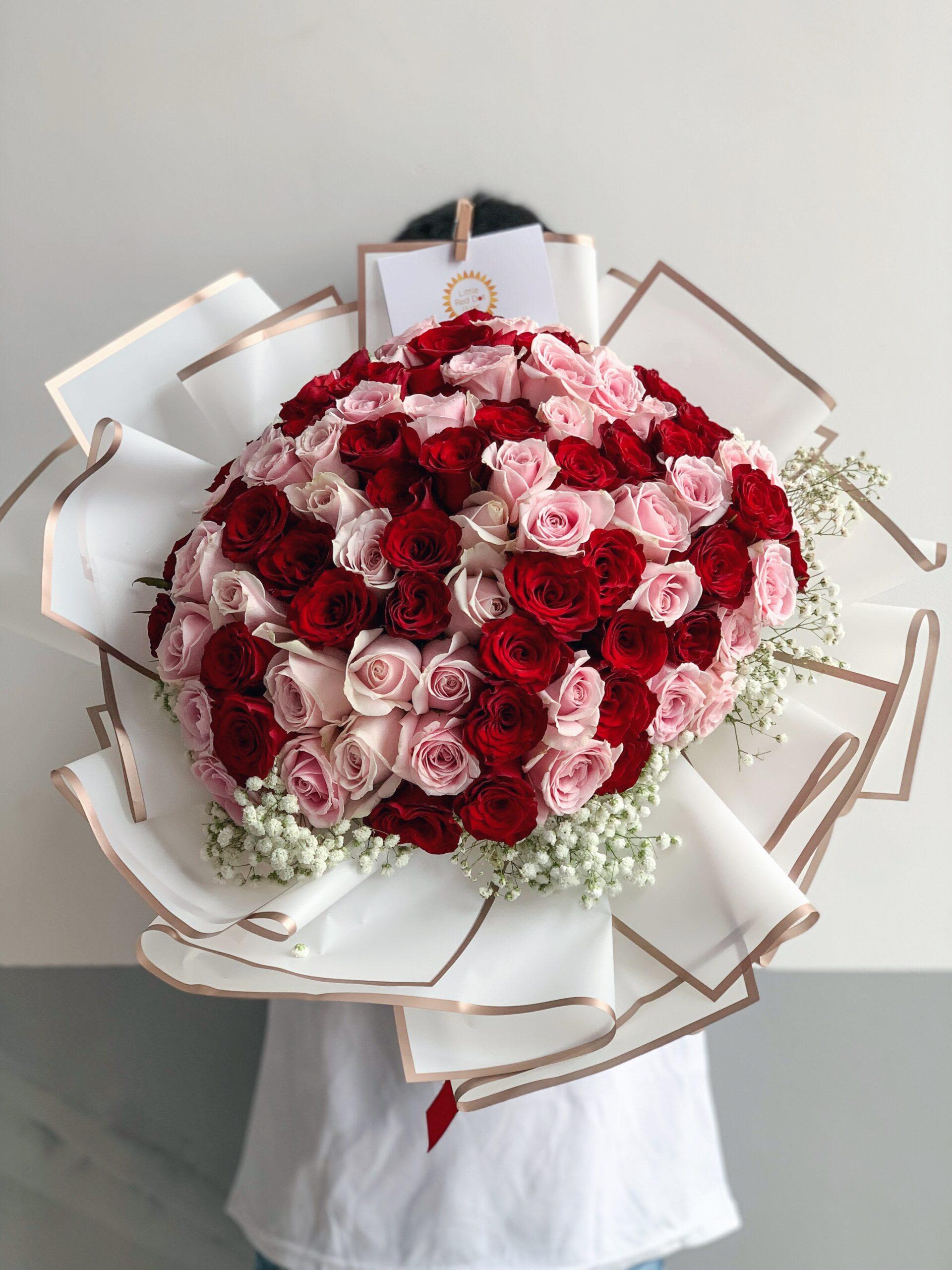 I SIMPLY LOVE YOU - Our magnificent bouquet features 99 Pink and Red Roses and filling Foliage.