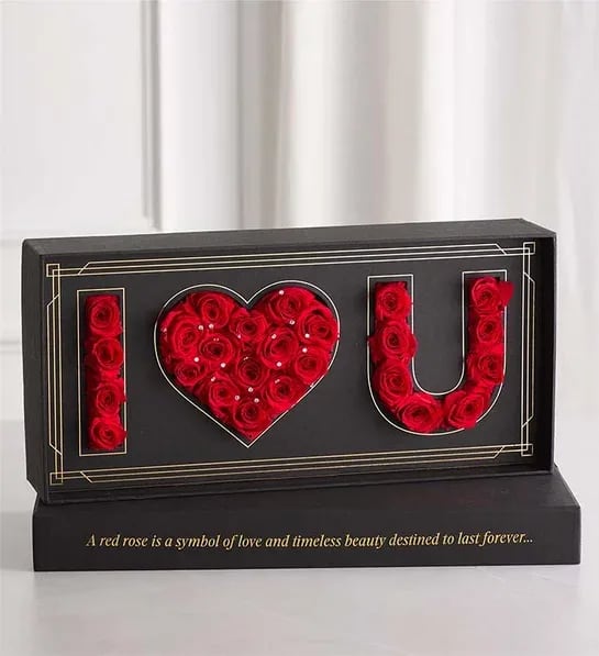 I LOVE YOU box - EXCLUSIVE The most luxurious way to your send your love. Exclusively designed for 1-800-Flowers, our genuine red roses are selected for their size and perfection, carefully preserved to maintain their beauty and artfully arranged to spell out “I Heart U.” Sparkling crystal accents and a sleek black sentiment gift box add to the glamour, creating a Valentine’s surprise like no other.