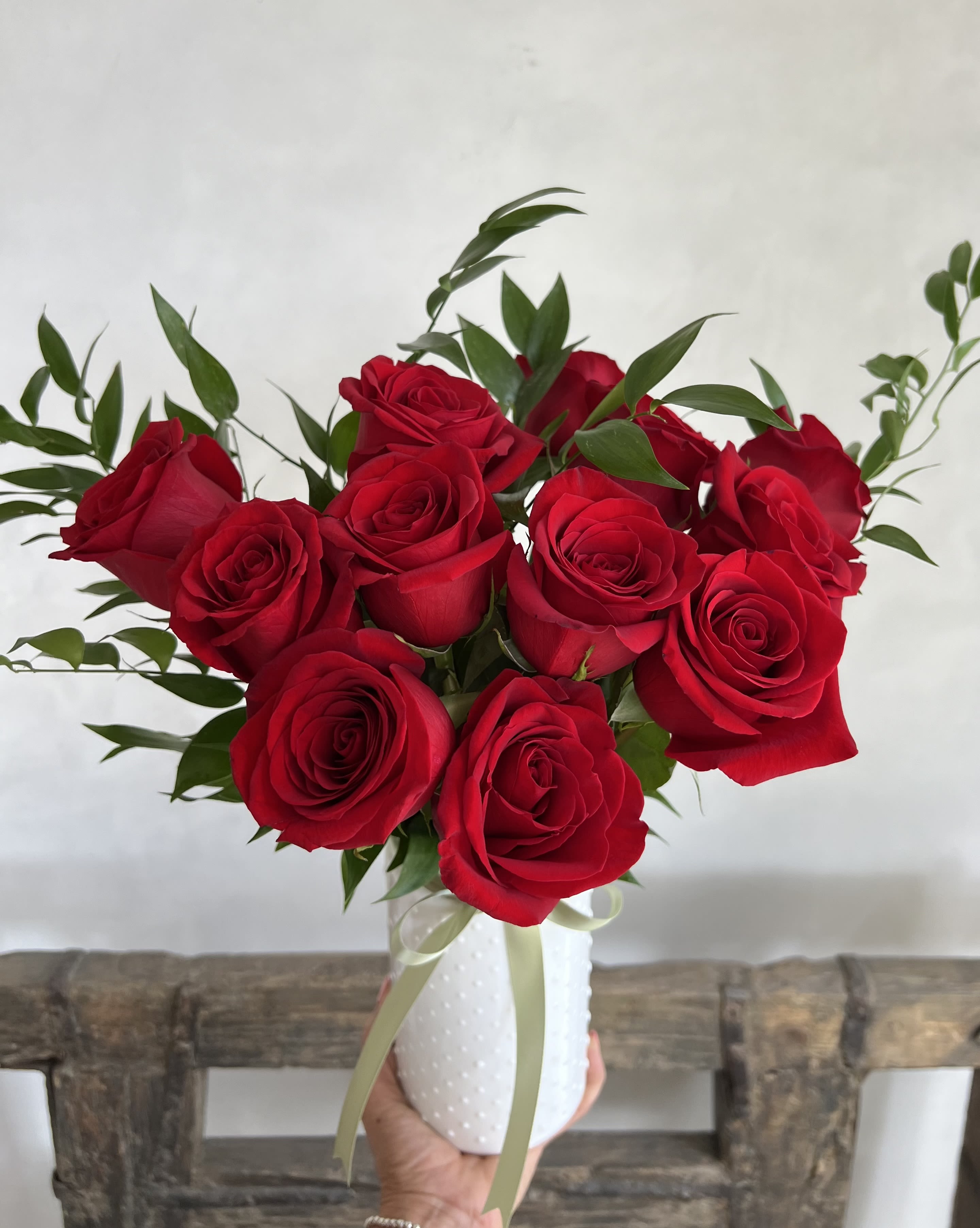  Roses of Love - One Dozen vibrant red roses beautifully arranged to express love and devotion. Simple, elegant , and perfect for any romantic occasion. 