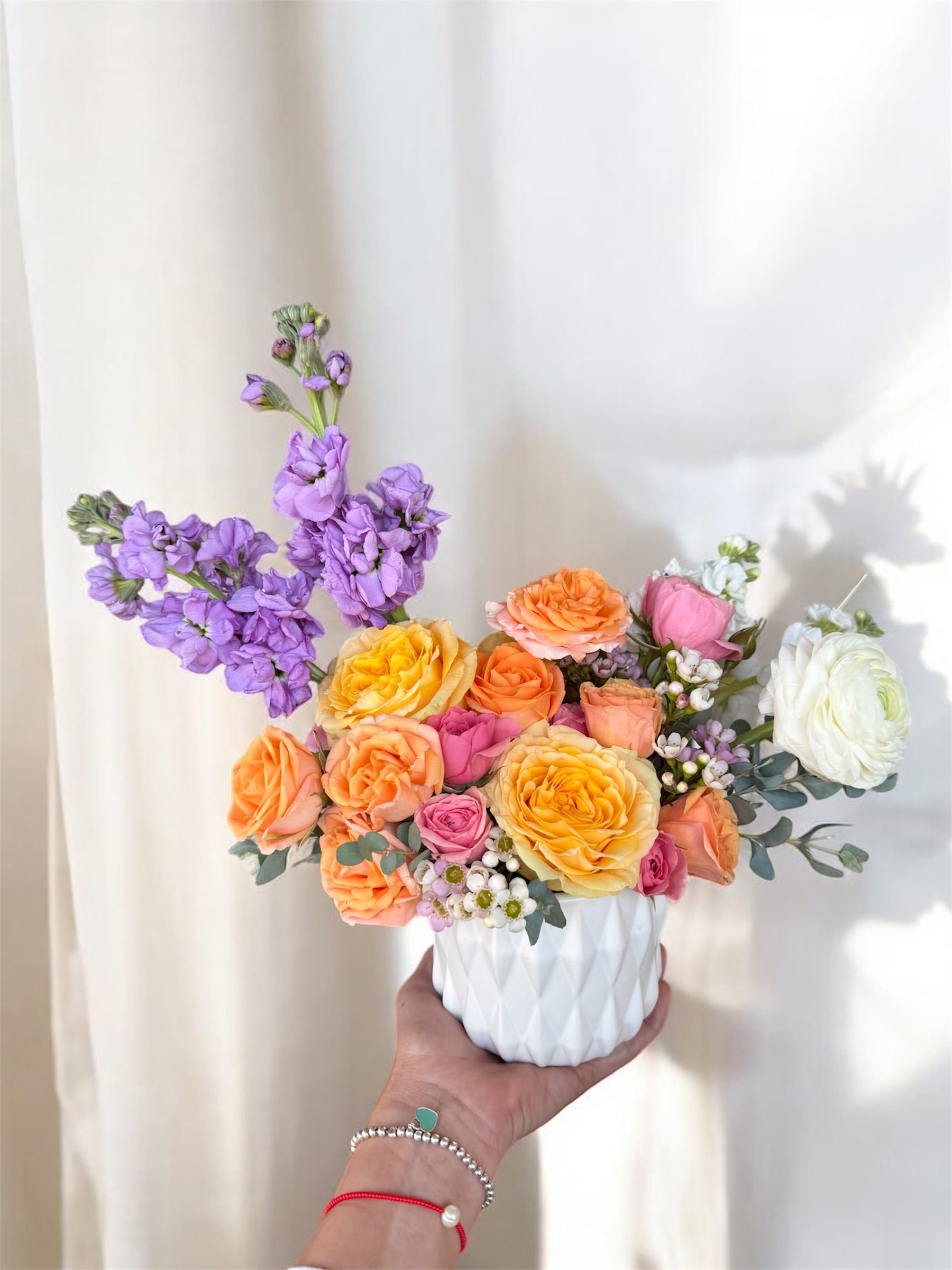 Blooming Surprise - This arrangement features a unique mix of fresh flowers, varying each week based on availability from our cooler. The image provided is a reference for size, though the colors and flower selection will change with each arrangement. Perfect for a wide range of occasions—whether you want to say thank you, wish someone a happy birthday, or simply brighten their day! 