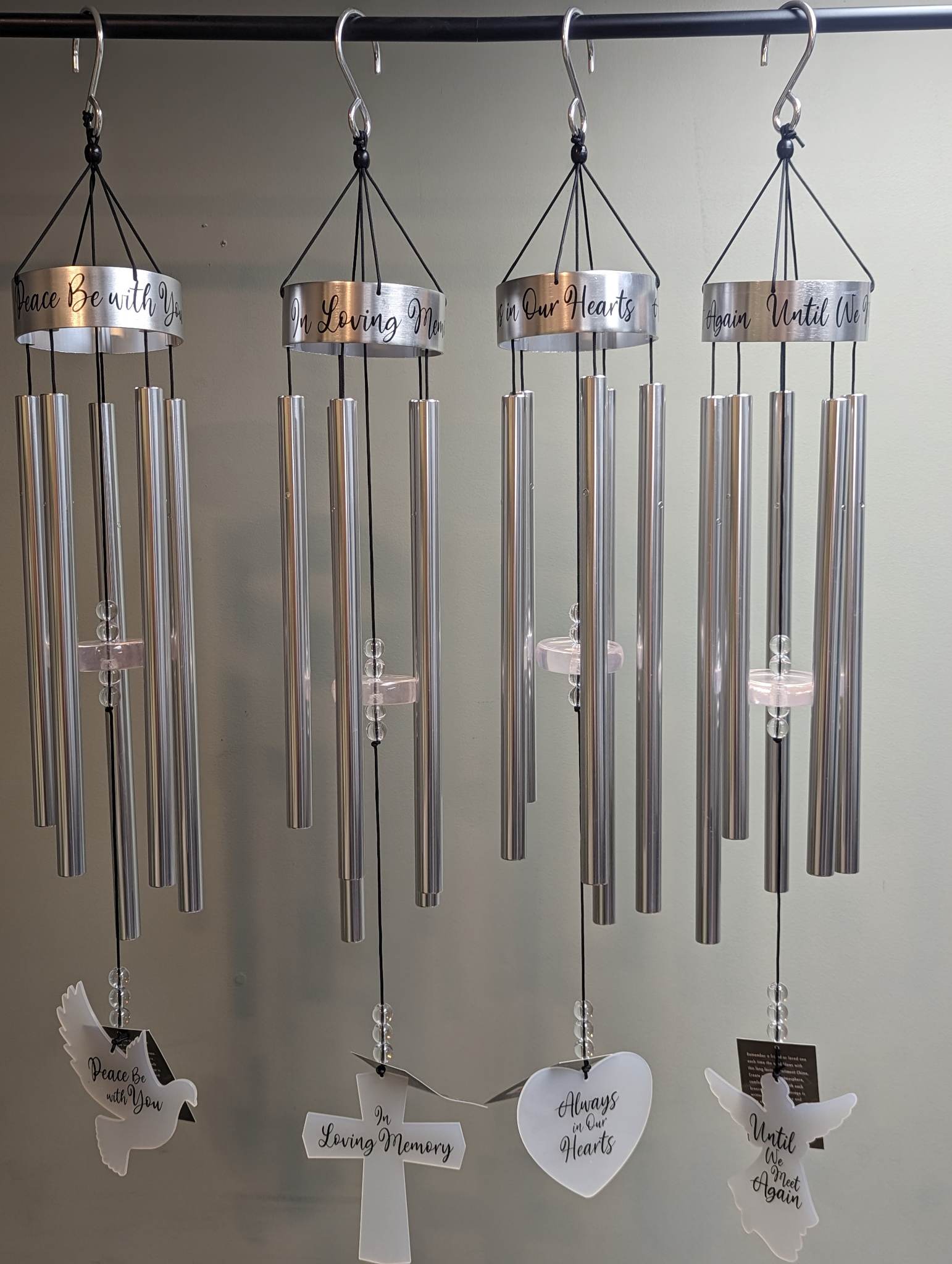 Sincere Sentiments Wind Chimes Sincere Sentiments Wind Chimes - Remember a friend or loved one each time the wind blows with this long lasting Sincere Sentiments Wind Chime. Create a relaxing atmosphere, comforting the soul with each breeze. A heartfelt message is written atop the canopy and also on the acrylic sail. Available in four different messages "In Loving Memory" "Always in our hearts" "Until we meet again" or "Peace be with you"; Chimes are 32"
