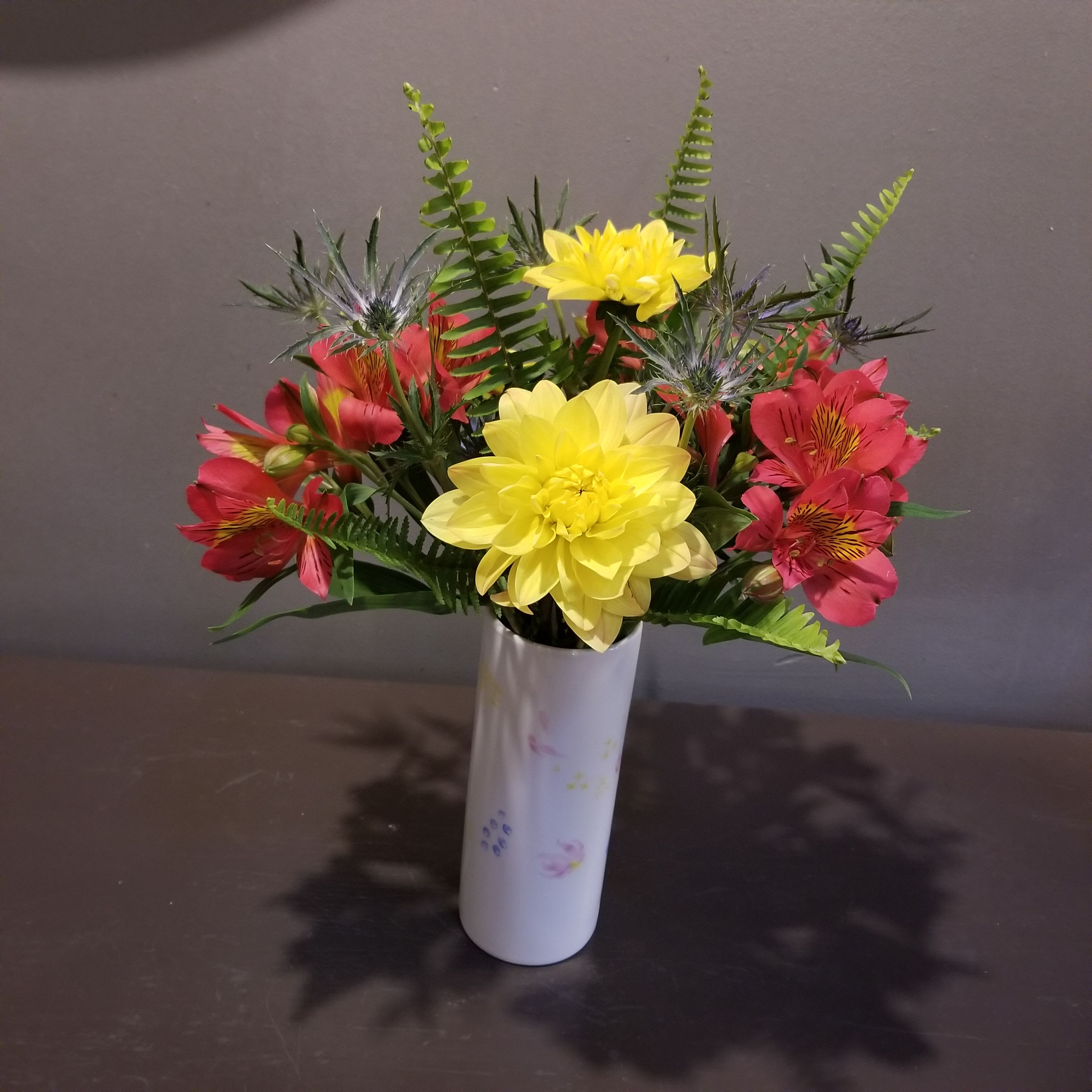 Isn't She Lovely - This bouquet is filled with a thisle and locally grown alstroemeria and dahlias.  Measures approx. 17&quot;Tx12&quot;W and arrives in a keepsake ceramic vase.