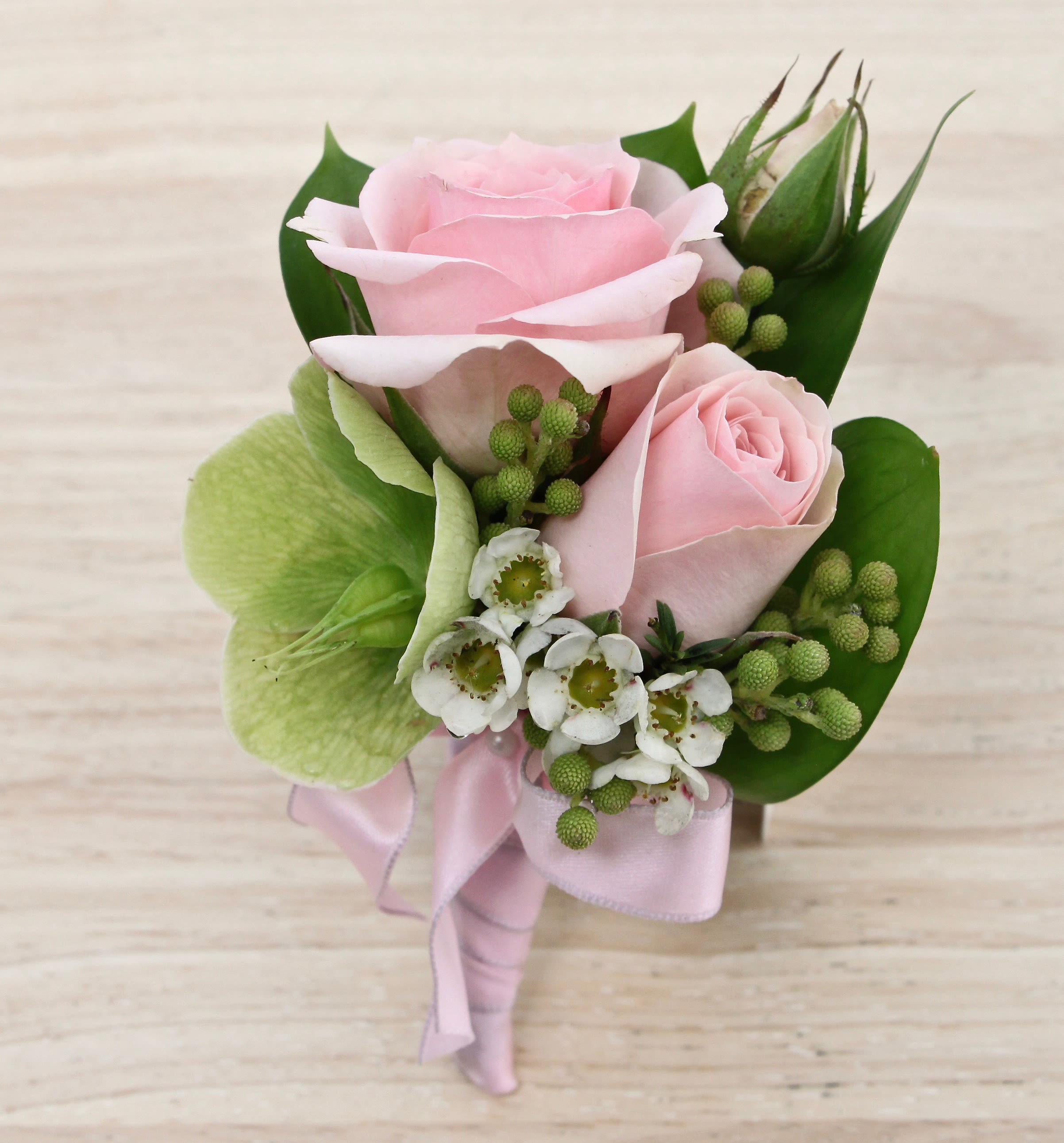 Rose Or Orchid Boutonniere - My Glendale Florist  - Orchid or rose boutonniere include seasonal greens, and a ribbon in the color of your choice. Please specify what colors you would like for flowers at checkout and we'll confirm the order once placed. Call or text us if you would like to discuss 8182440200.   If you are interested in a boutonniere for any occasion, please order at least 24 hours in advance.  