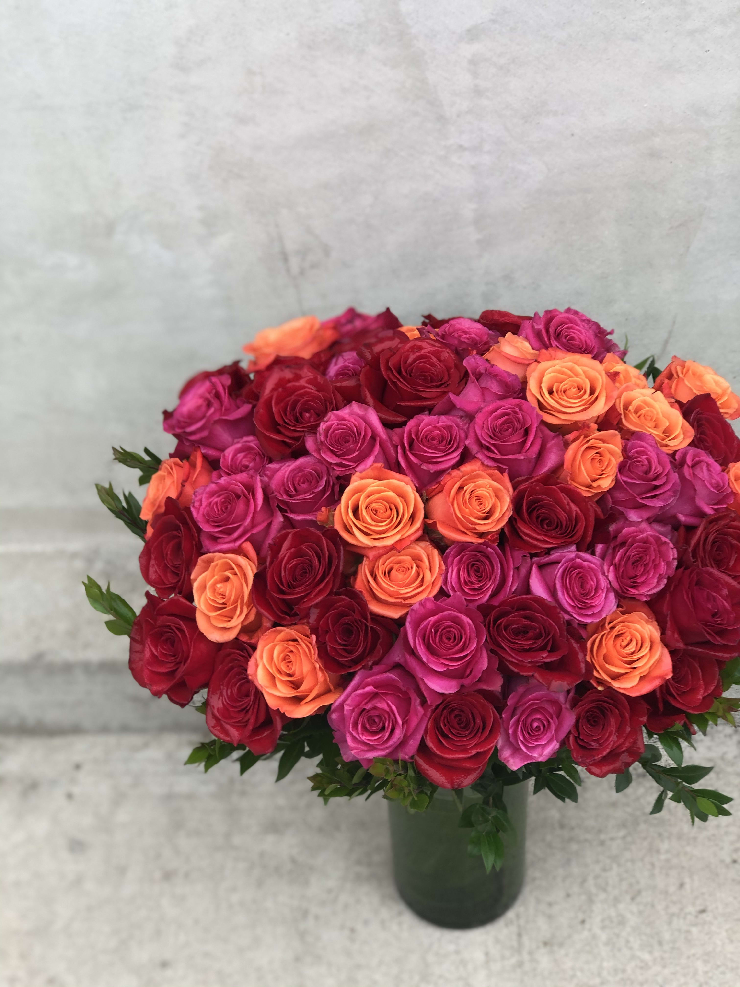 60 Long Stem Roses 60 Long Stem Roses - This lush beautiful arrangement is carefully crafted with 60 long stem roses and foliage in a glass vase. *Measures 24in tall, 12in wide
