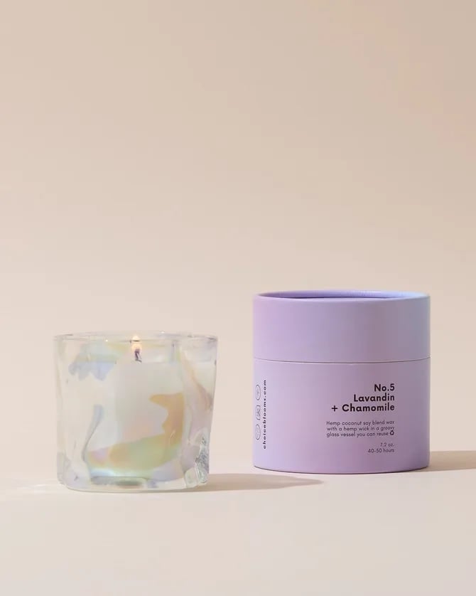 Lavandin + Chamomile Candle  - No. 5 Lavandin + Chamomile made with hemp coconut soy blend wax+burns with a hemp wick all in a groovy translucent IRIDESCENT glass vessel meant to be reused. *Each vessel is unique in shape 7.2 oz. in an 8 oz vessel. 40-50 burn time hours  The Smell: No. 5: Lavandin + Chamomile- floral, spa aroma, relaxing, subtle. Top:  Lavandin, Juniper Water, Yarrow  Heart:  Coconut, Chamomile, Sweetgrass  Base:  Vanilla Musk, Dry Woods, Clary Sage