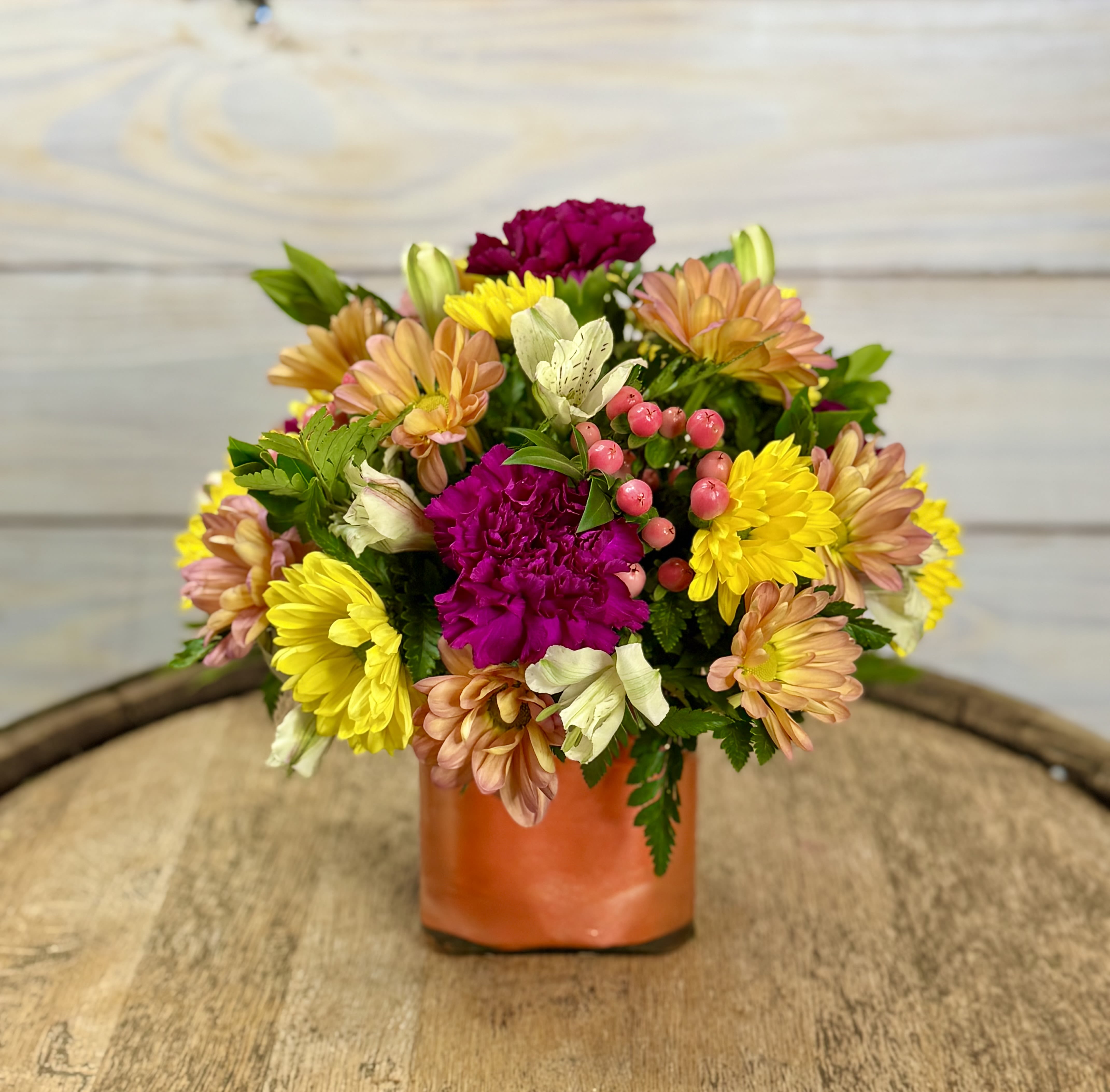 Blossom Breeze - A cute and colorful arrangement of spring flowers. Perfect for a desktop or your kitchen counter.  ****We will try our best to match the flowers in the picture, but there may be times when we substitute flowers. We will always try to make it have the same look and feel as the original.****