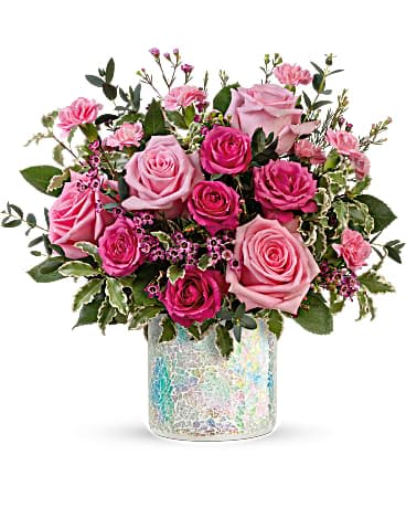 Teleflora's Gorgeous Glimmer Bouquet Teleflora's Gorgeous Glimmer Bouquet - Mom is sure to perk up when this pink-tastic rose bouquet arrives, artfully arranged in a shimmering mosaic glass keepsake vase! This perky pink bouquet includes pink roses, hot pink roses, miniature pink carnations, lavender waxflower, pitta negra and parvifolia eucalyptus. Delivered in Teleflora's Shine in Style Cylinder.
