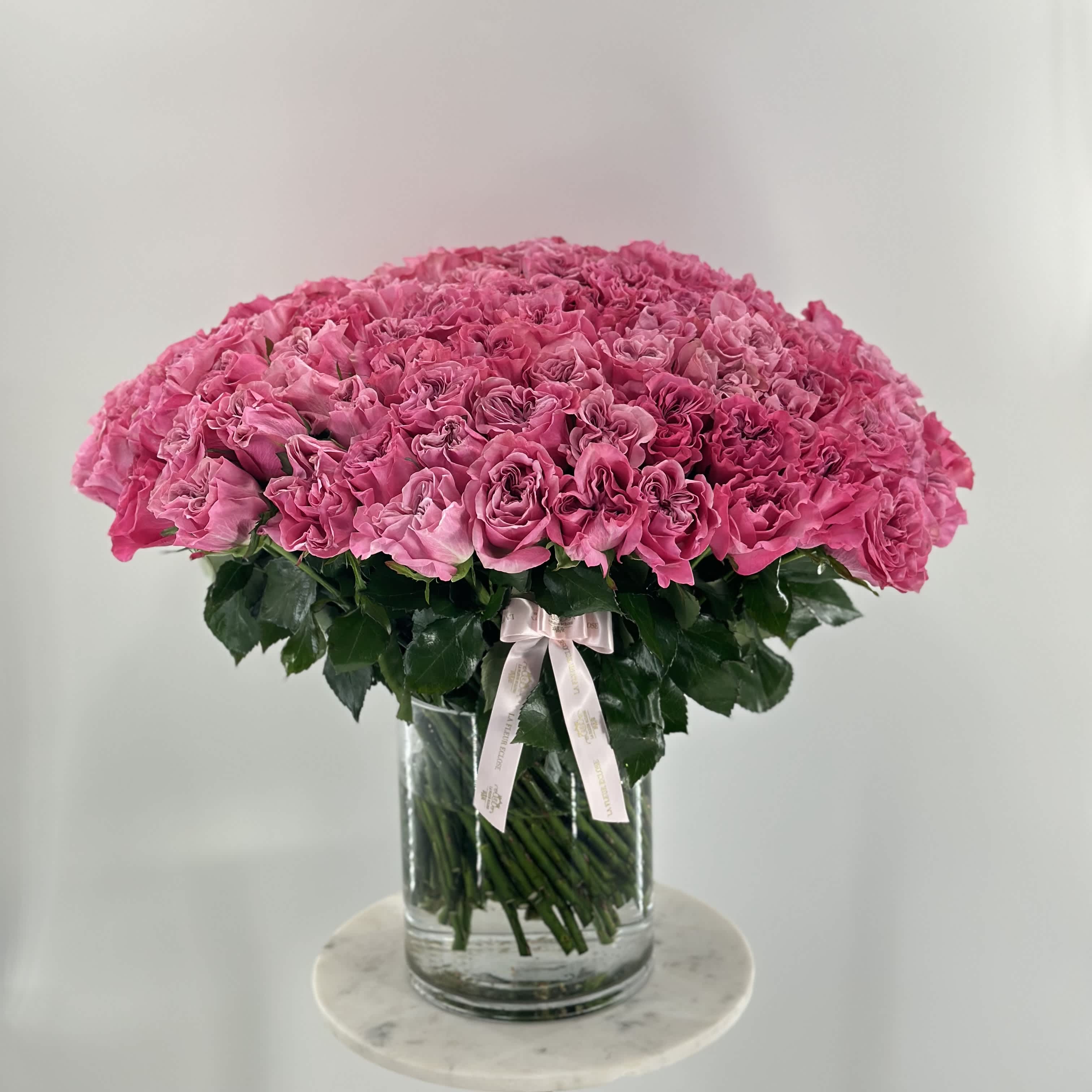 Heart shape fantasy  - 100 fresh-cut heart shape pink roses in a vase  