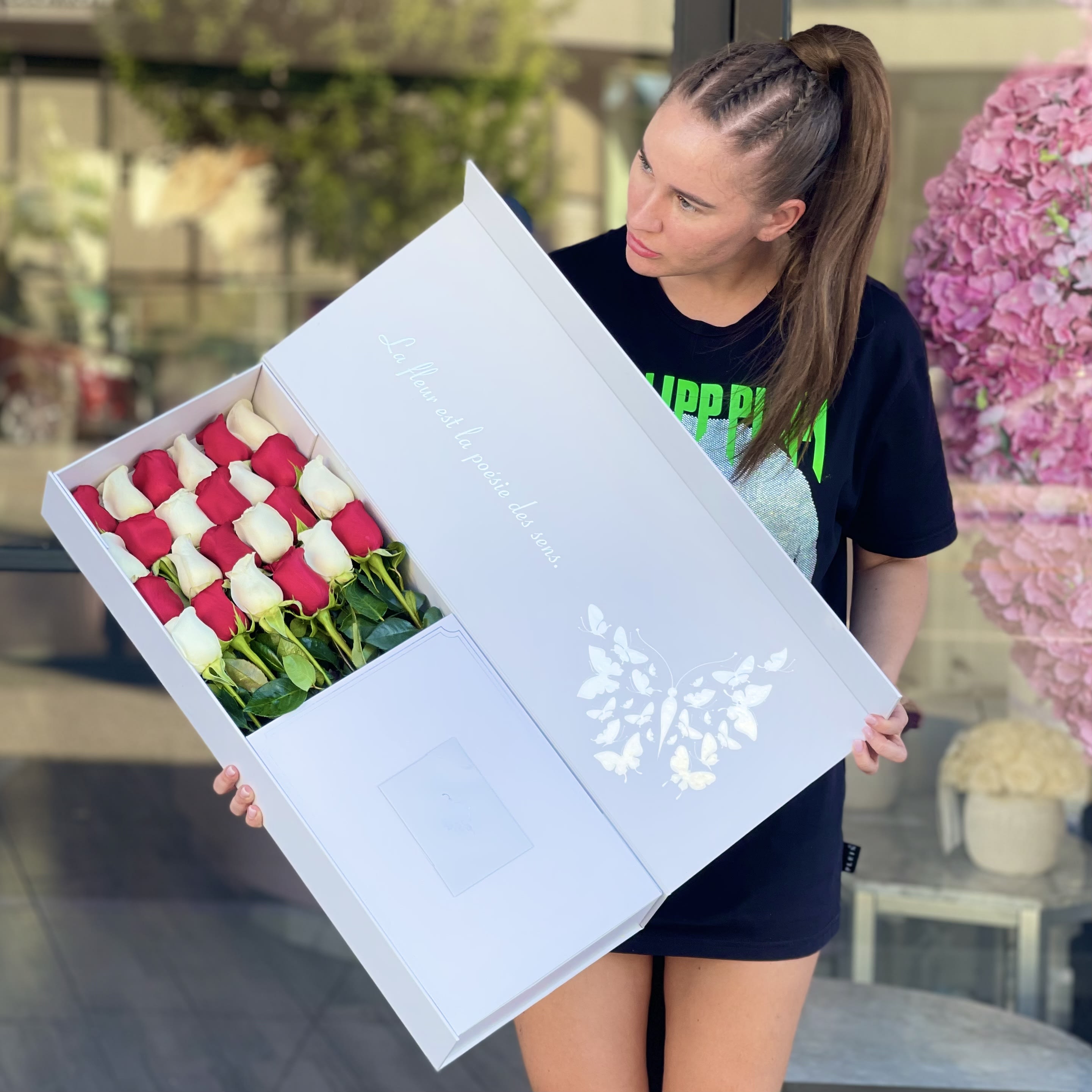 Surprise in red and white - These stunning red and white  roses in our signature box will leave your loved ones speechless! Standard includes 4 rows and deluxe 5
