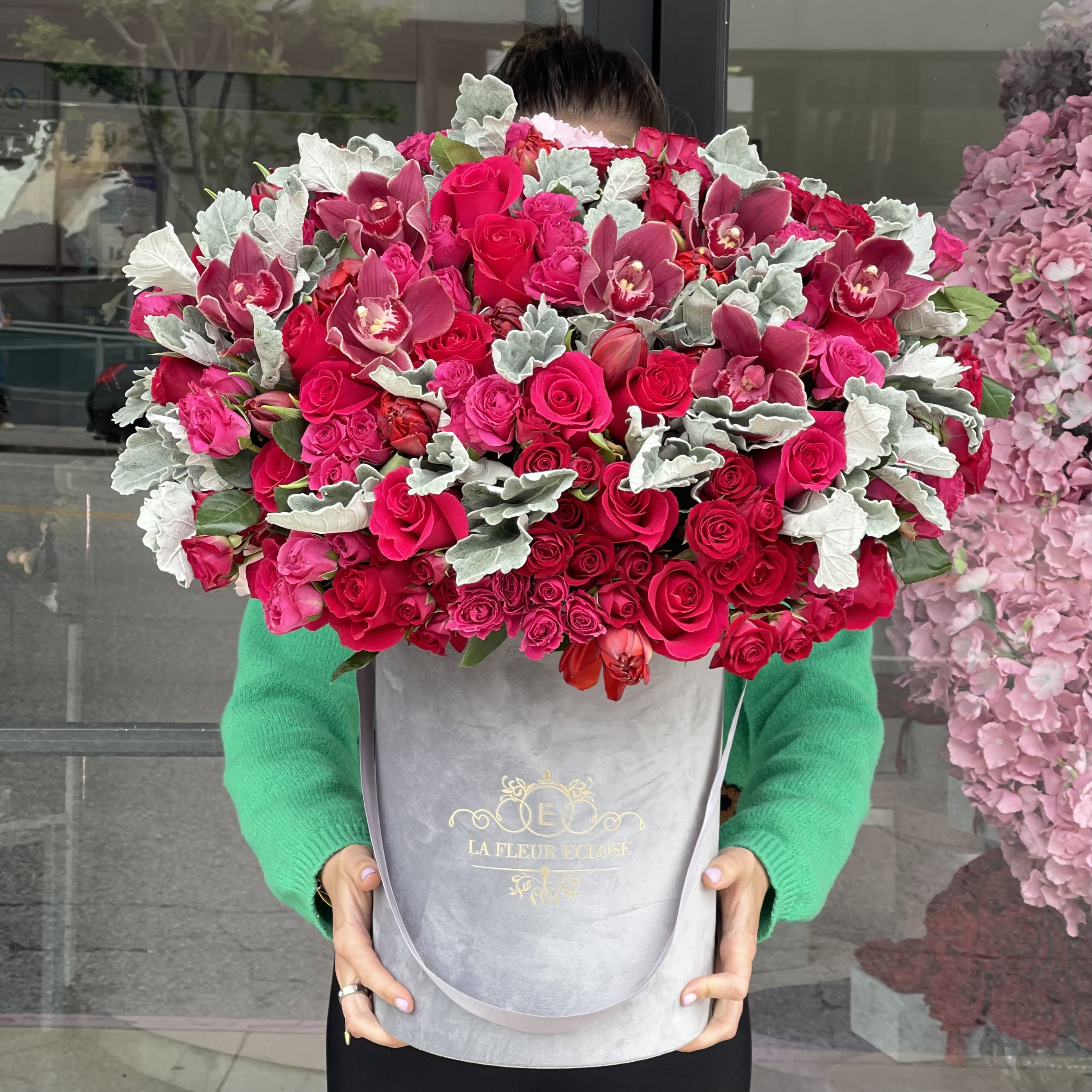 Dusty Hot Red - Hot pink roses, orchids in a gray velvet box
