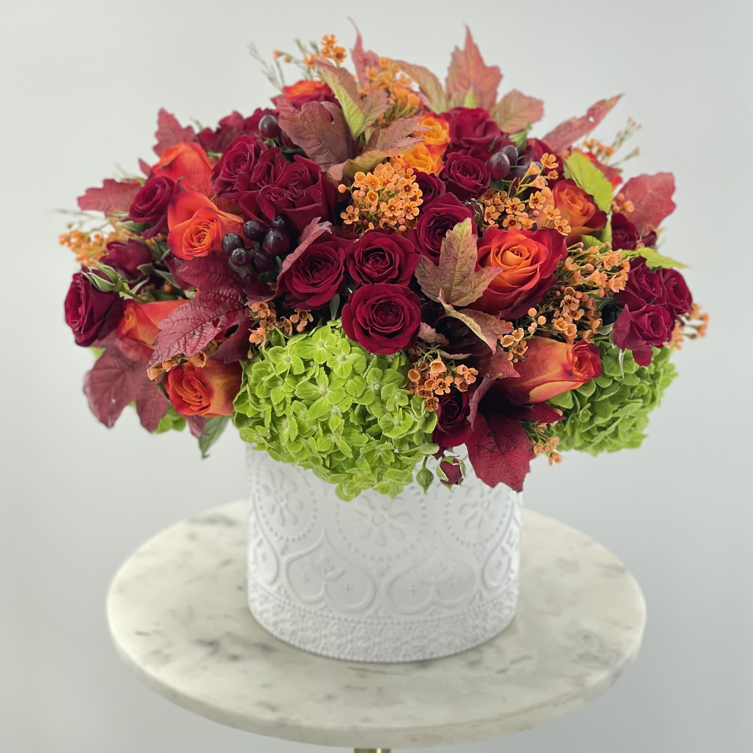 Bright vase - White ceramic vase with fresh bright autumn inspired arrangement 
